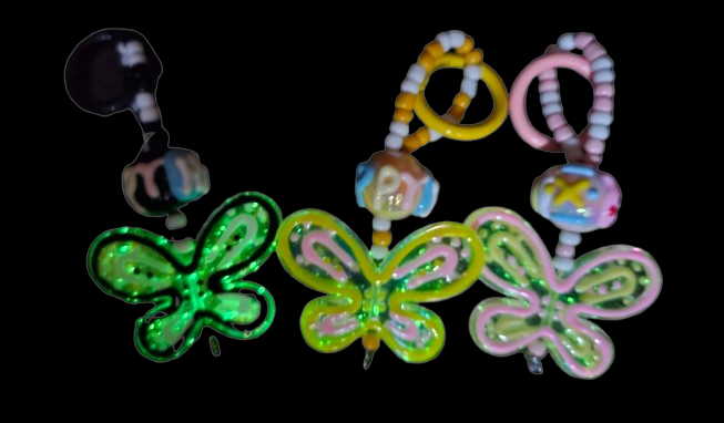 Butterfly charm glows in the dark.