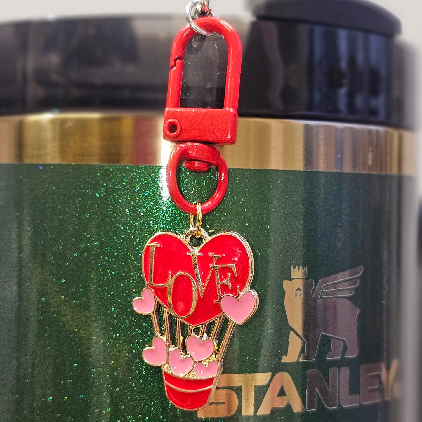 Red, pink, and gold love balloon tumbler straw charm.