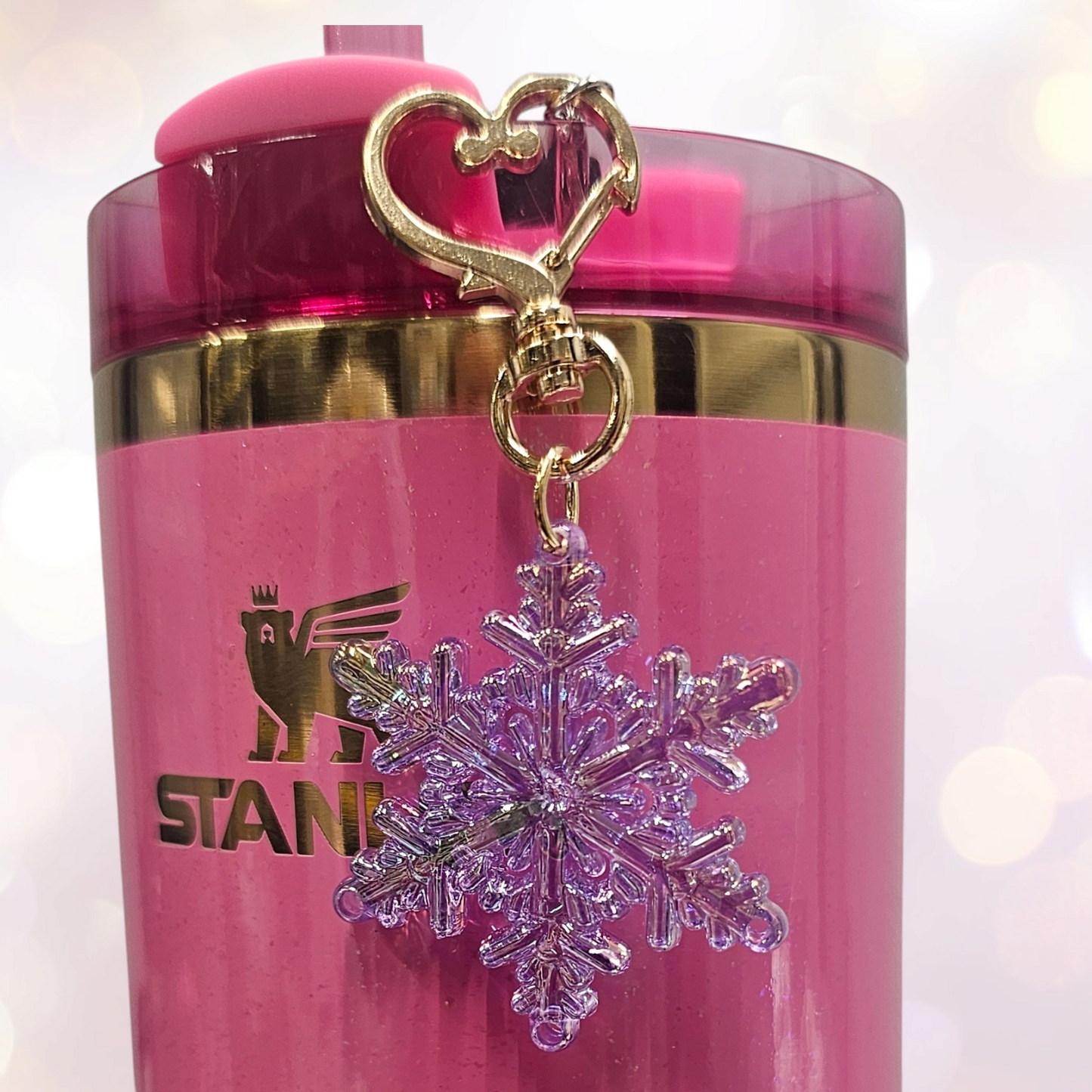 Pearlescent purple Snowflake tumbler straw charm with gold heart clasp.