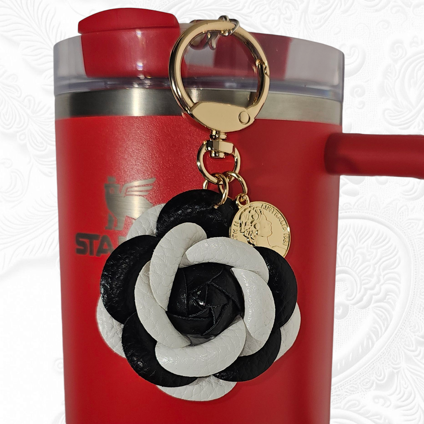 Black and White Camelia Flower with gold keyring and swivel tumbler straw charm.