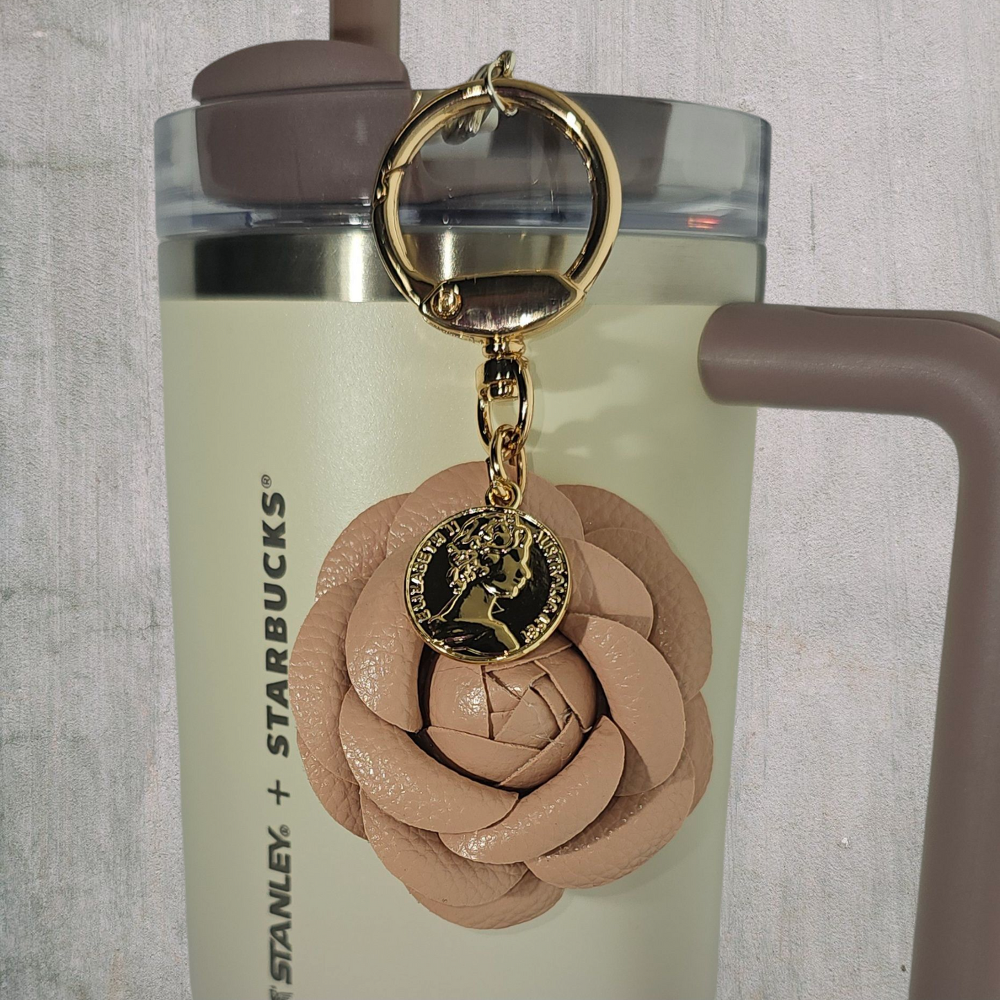 Camel brown Camelia flower with gold swivel keyring tumbler straw charm.
