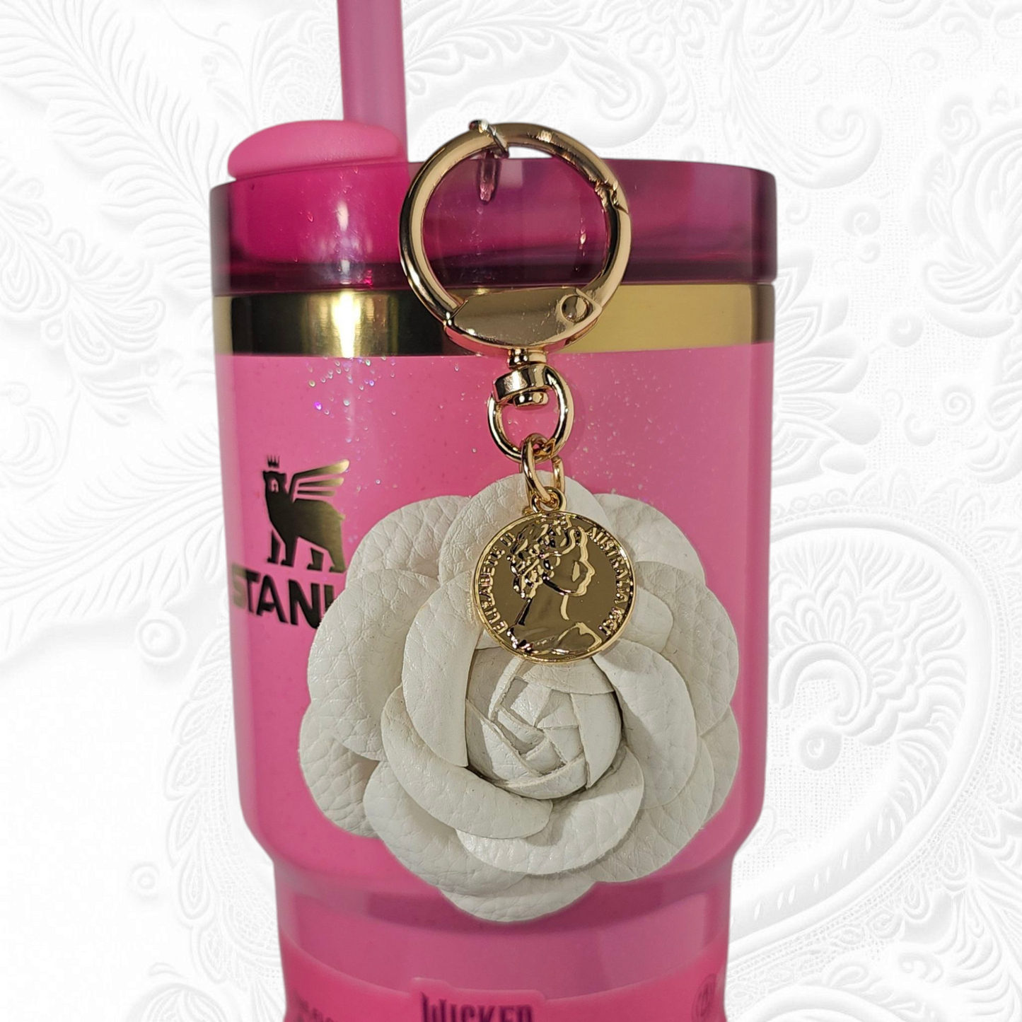 Luxury white camelia flower with a gold swivel keyring tumbler straw charm.