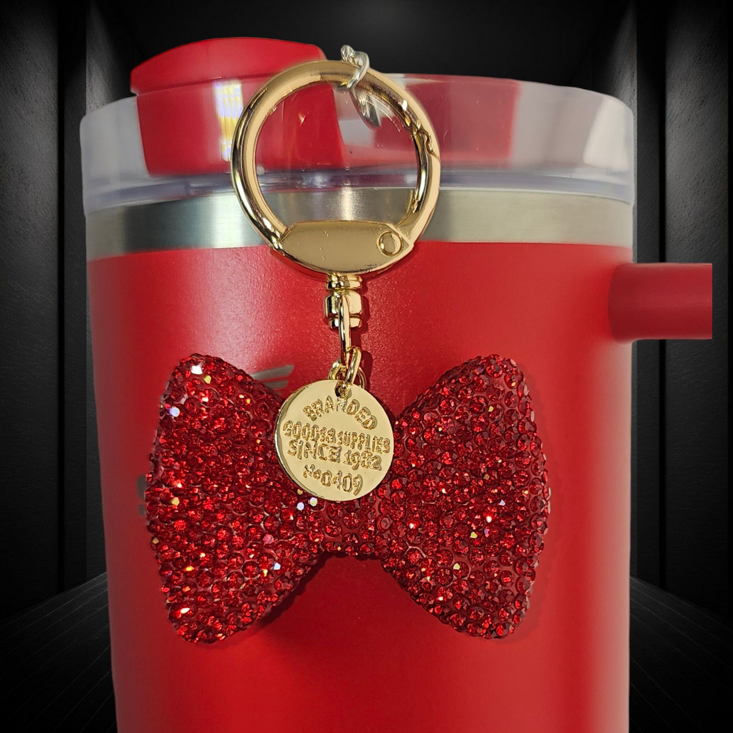 Red Glitter bow tie with gold swivel keyring tumbler straw charm.