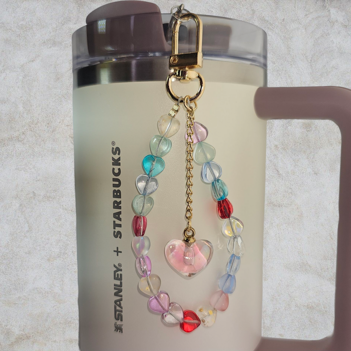 Deluxe Crystal Heart Beaded Tumbler Charm.
Iridescent Pearlescent Pink Crystal Heart Beaded Tumbler Charm.
Beads are multicolored. There are 3 styles so please reference the image linked to the style number when choosing.
