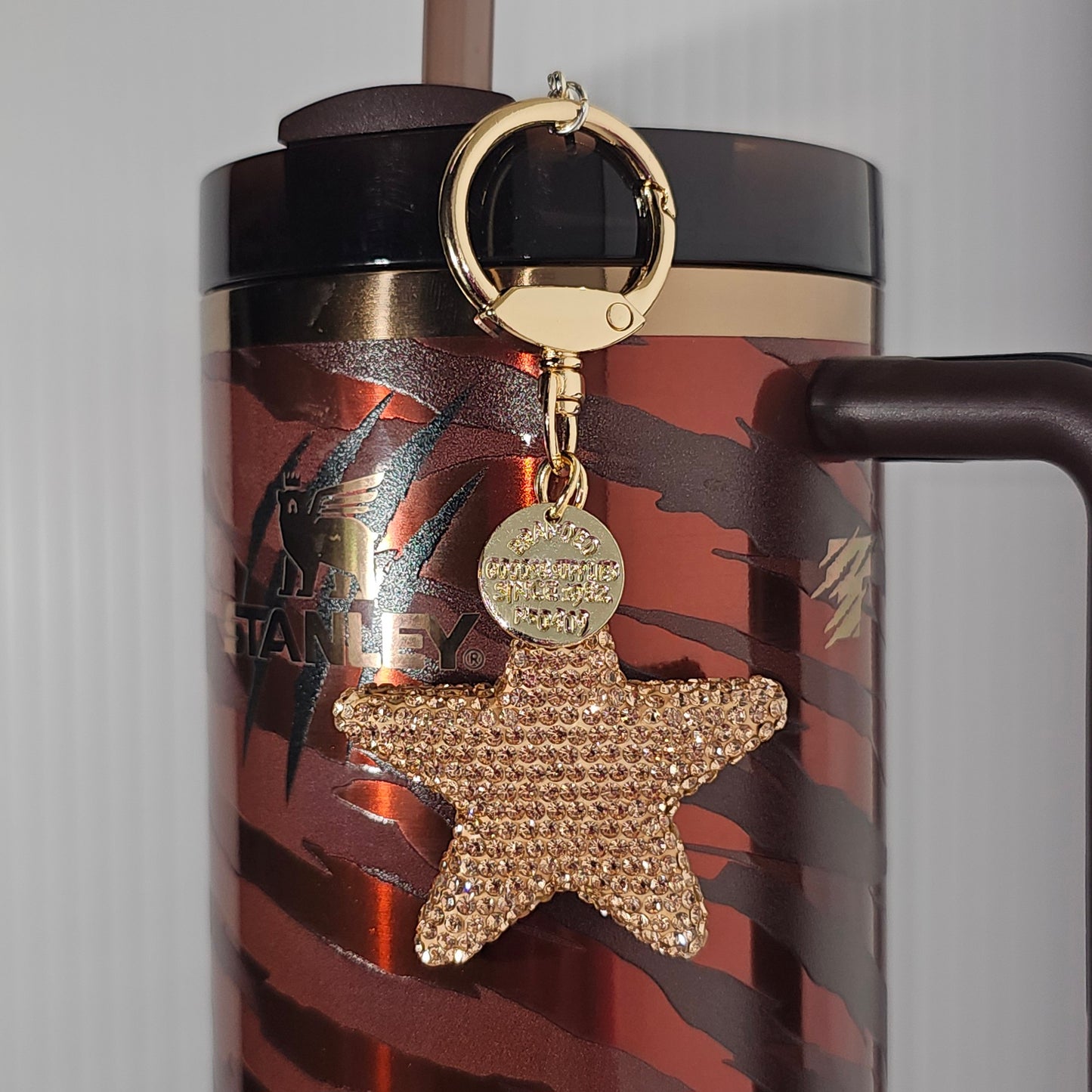 Luxury glitter star with gold swivel keyring tumbler straw charm.