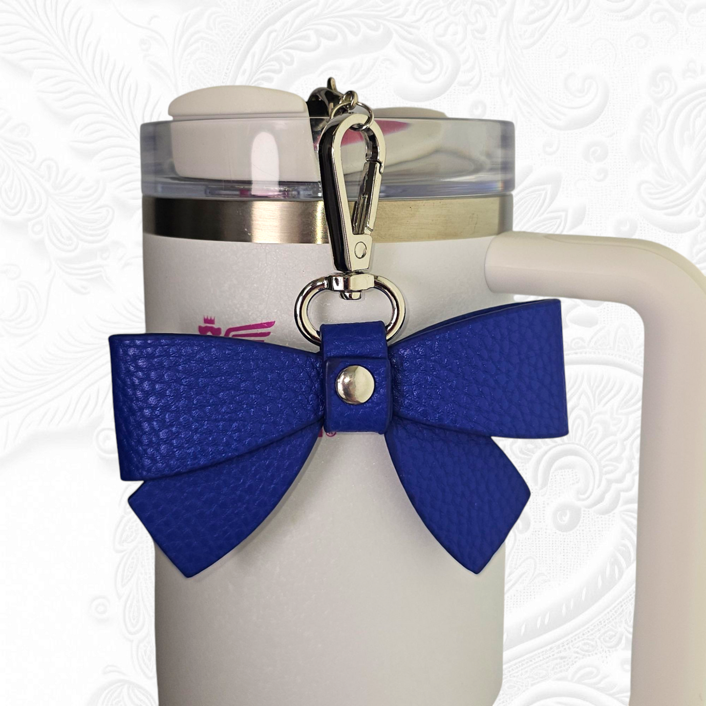 Blue faux leather ribbon bow tumbler charm.