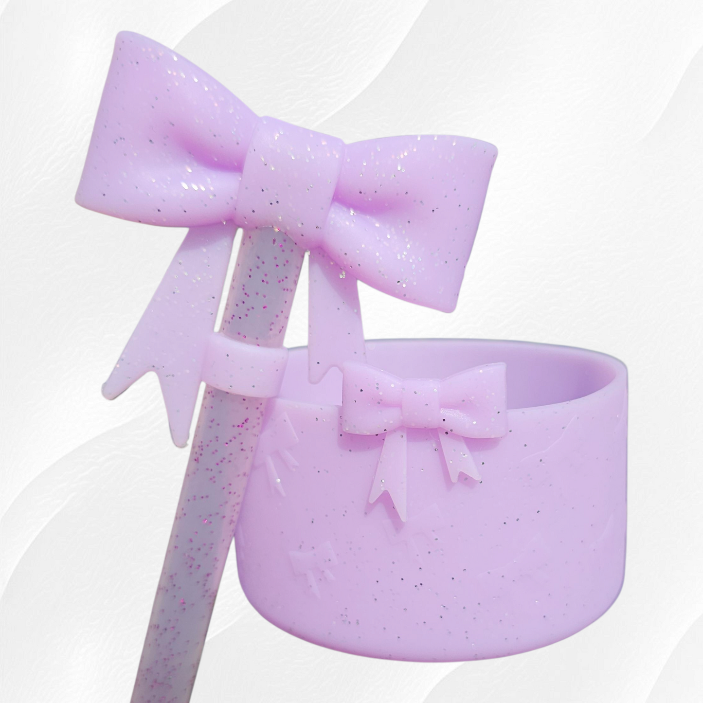 Purple glitter ribbon bow textured 3D silicone tumbler boot and matching 10mm bow straw topper.