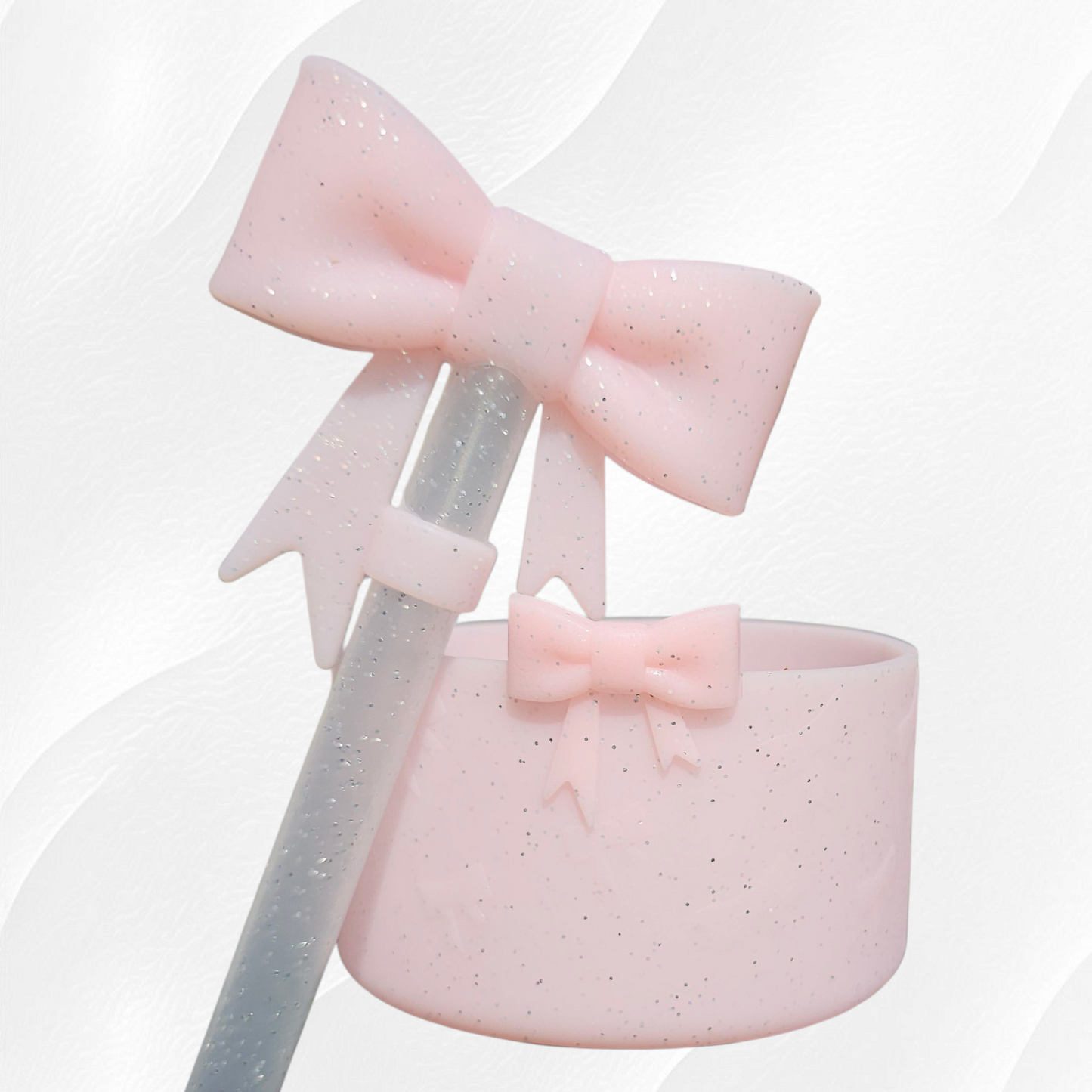 Pink glitter ribbon bow textured 3D silicone tumbler boot and matching 10mm bow straw topper.