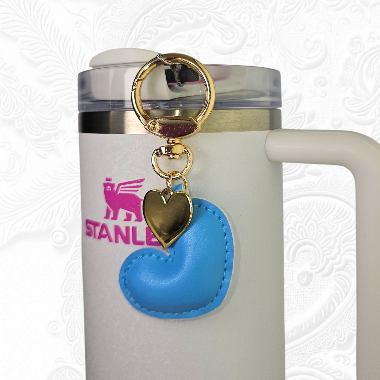 Blue leather heart and gold heart tumbler straw charm.