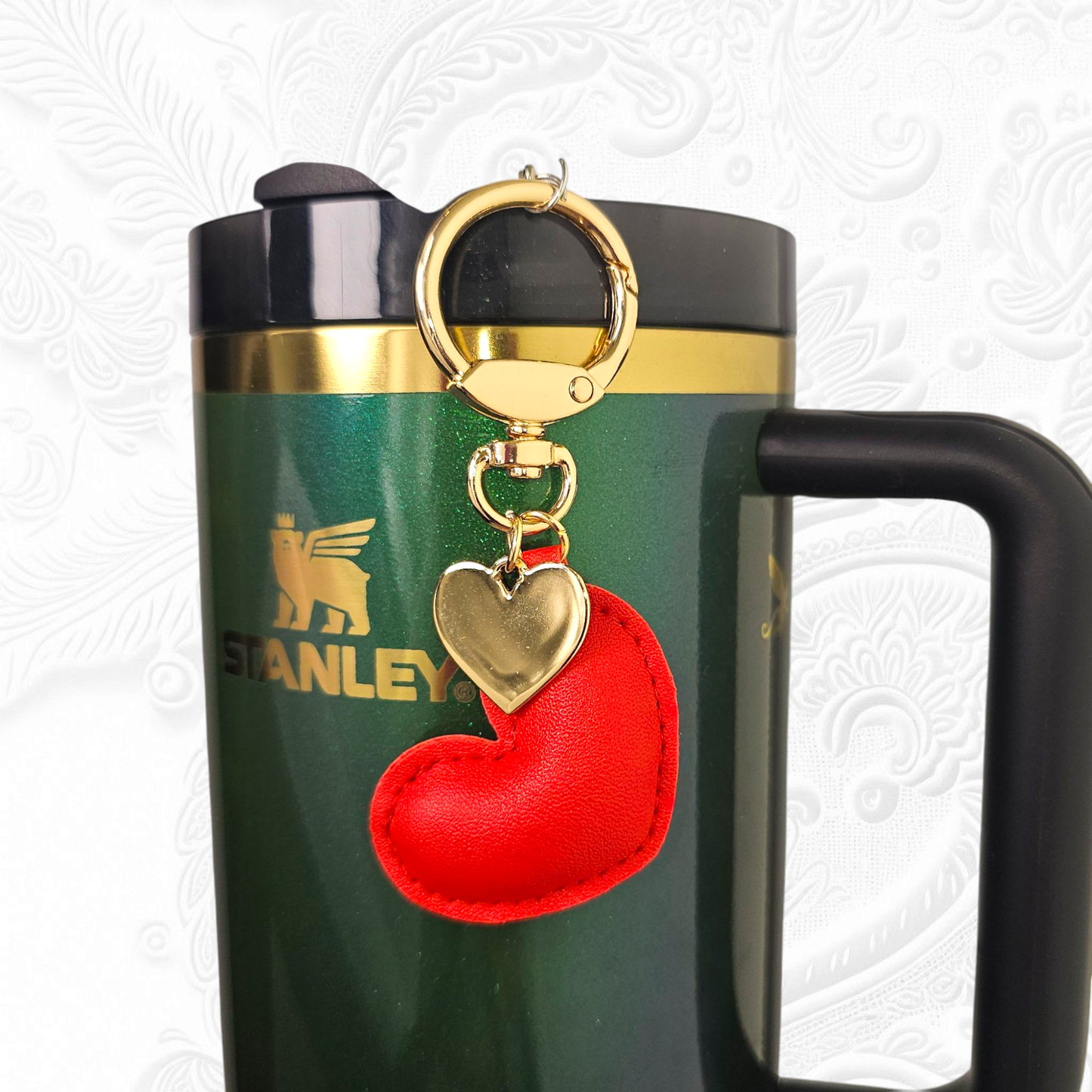 Red leather heart and gold heart tumbler straw charm.