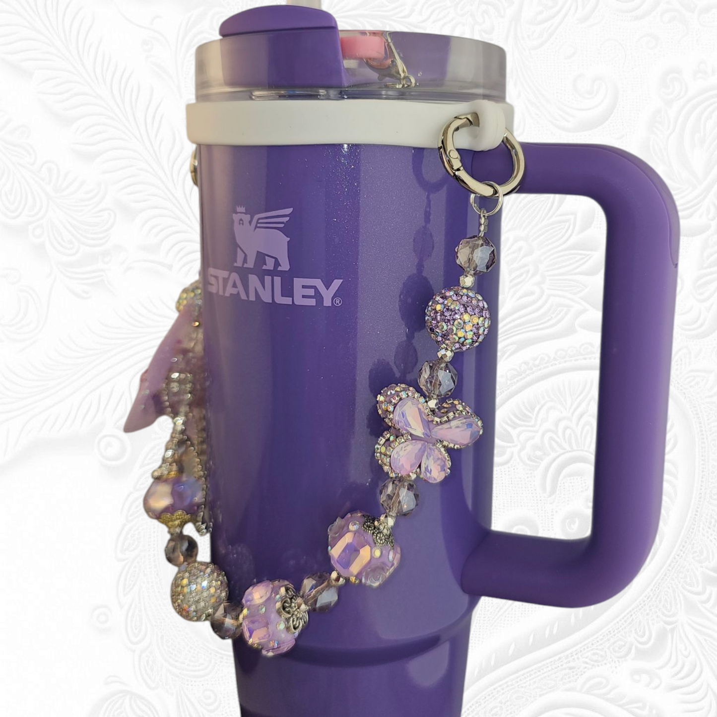 Deluxe Princess Beaded Tumbler Charm Necklace - Lavender Purple
Iridescent Pearlescent Lavendar Purple Crystal Beaded Tumbler Charm Necklace.
The center piece of this beautiful charm is the Jumbo Purple bow tie that is double-sided. One side has a purple sequin star while the other side has a crystal butterfly and diamonds. (diamonds are not real)