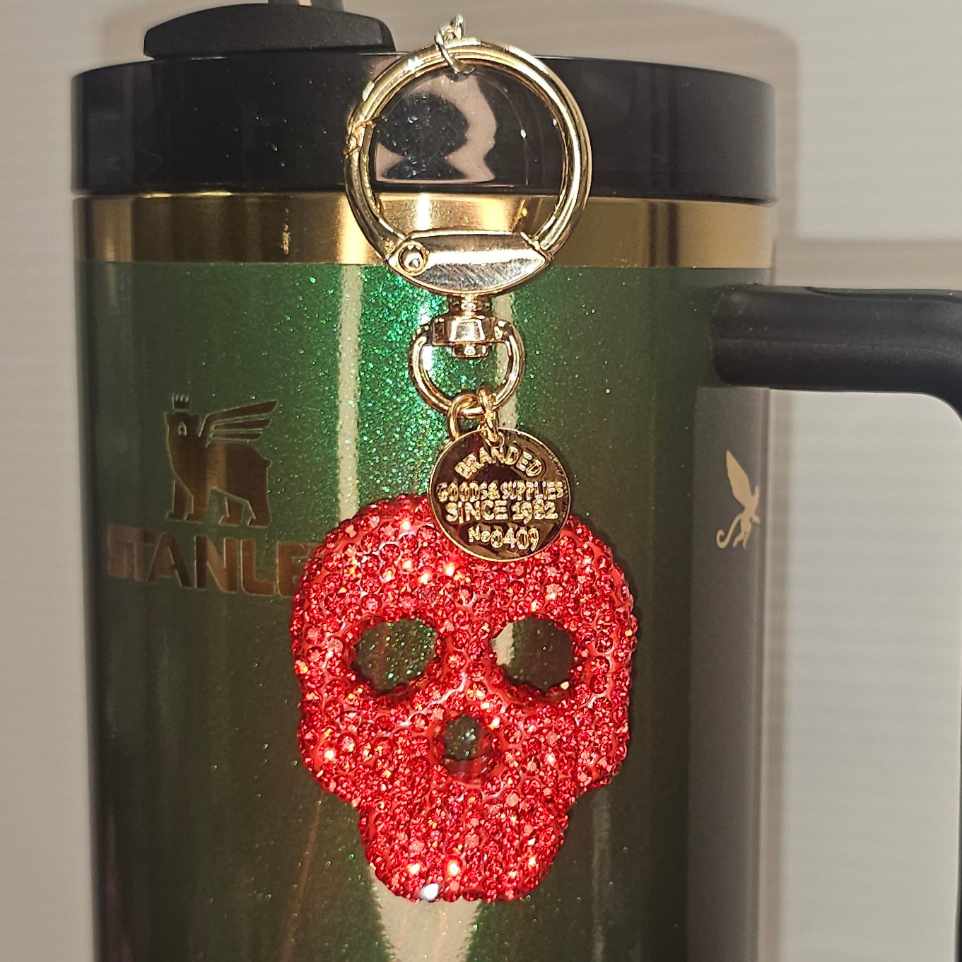 Red Glitter Coquette skeleton charm for tumbler straw, purse, bag, keychain, or backpack. Taken with camera flash.