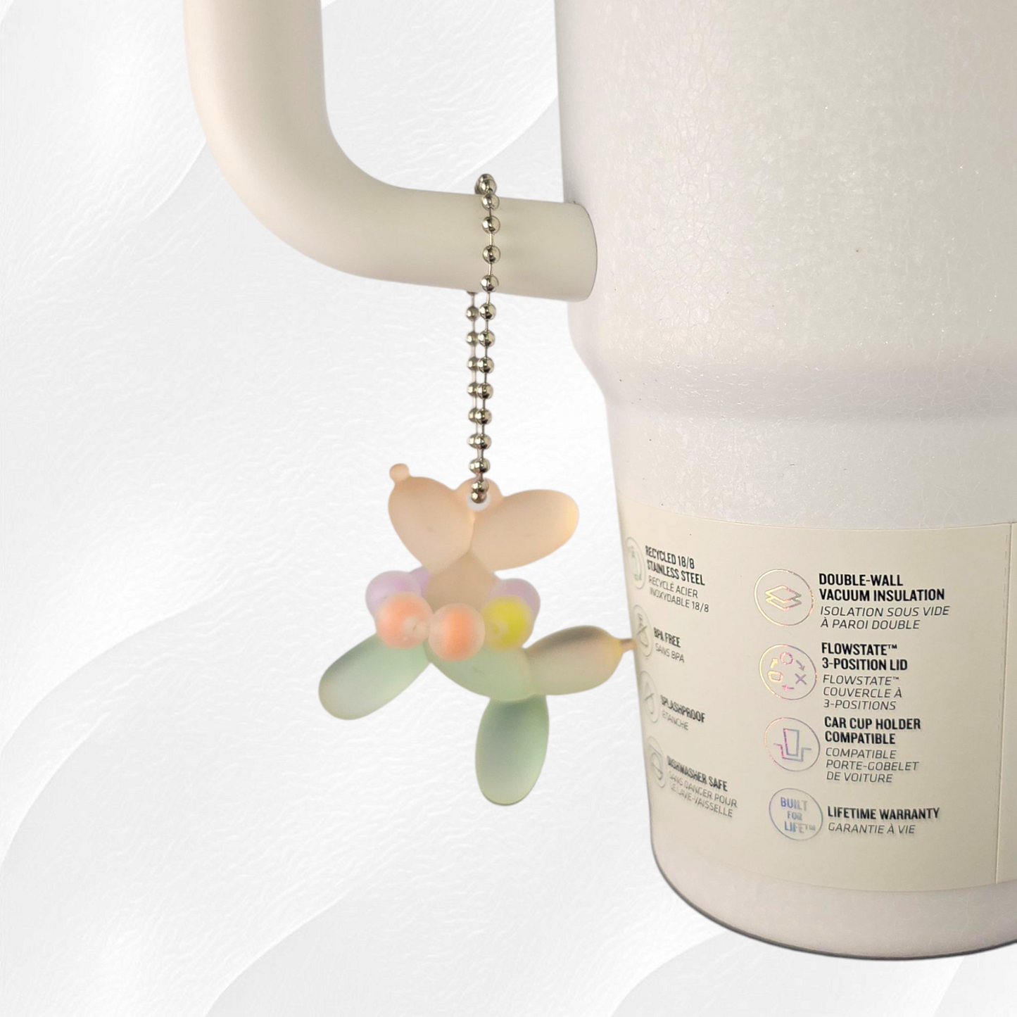 Green and Orange Ombre balloon dog wearing a beaded necklace tumbler charm.