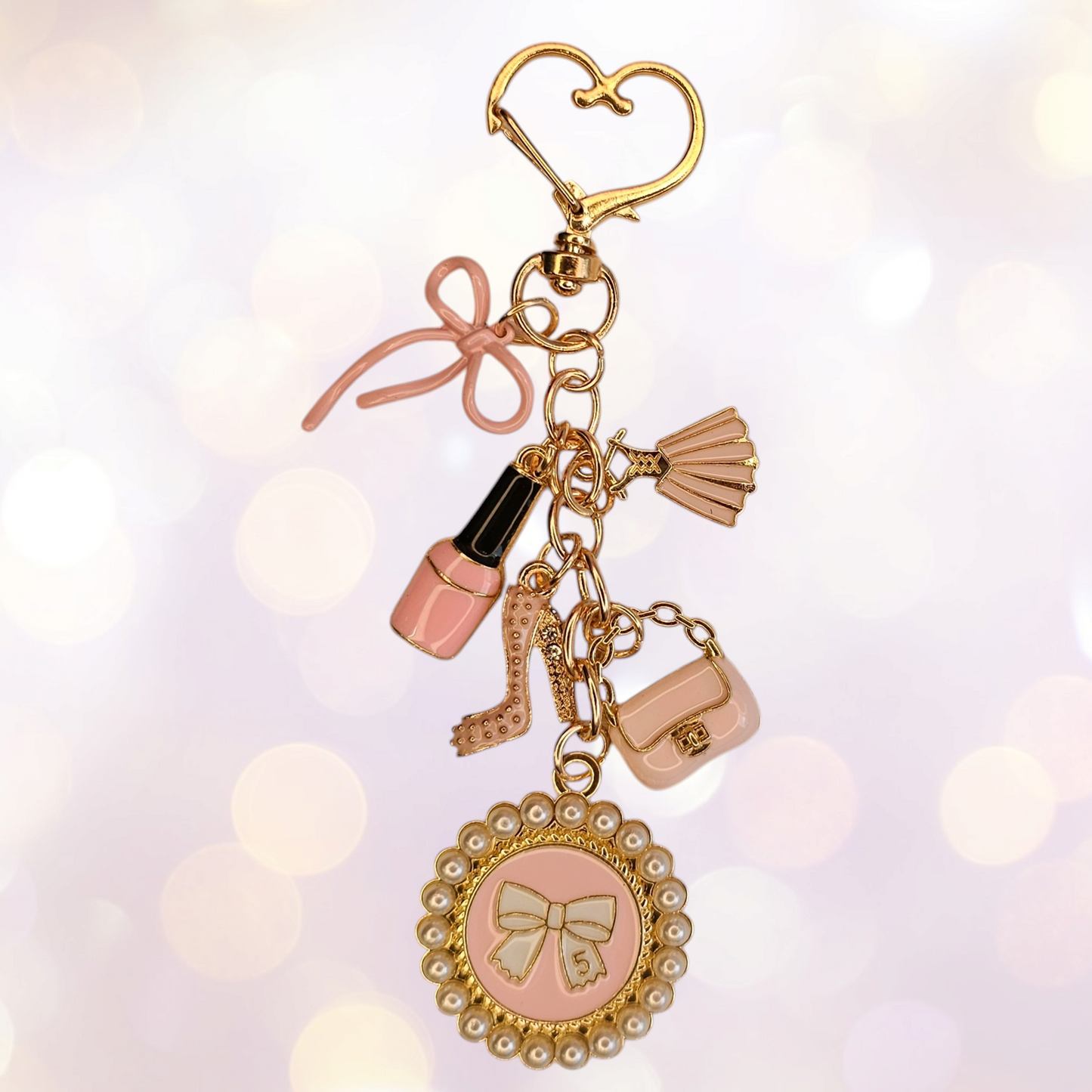 Luxury tumbler straw charm dangle for the classy Diva.
Colors are gold, white, and pink.
Charms consist of pink fingernail polish, glitter high heel, white pearl #5 bow, pink bow, and pink dress.
