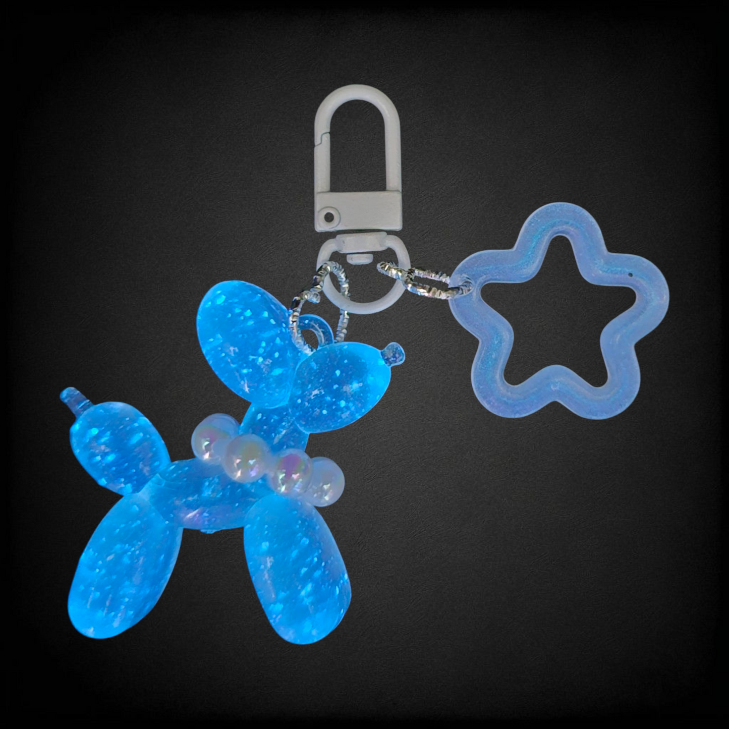 Blue Glow in the Dark Iridescent pearlescent balloon dog and star charm.