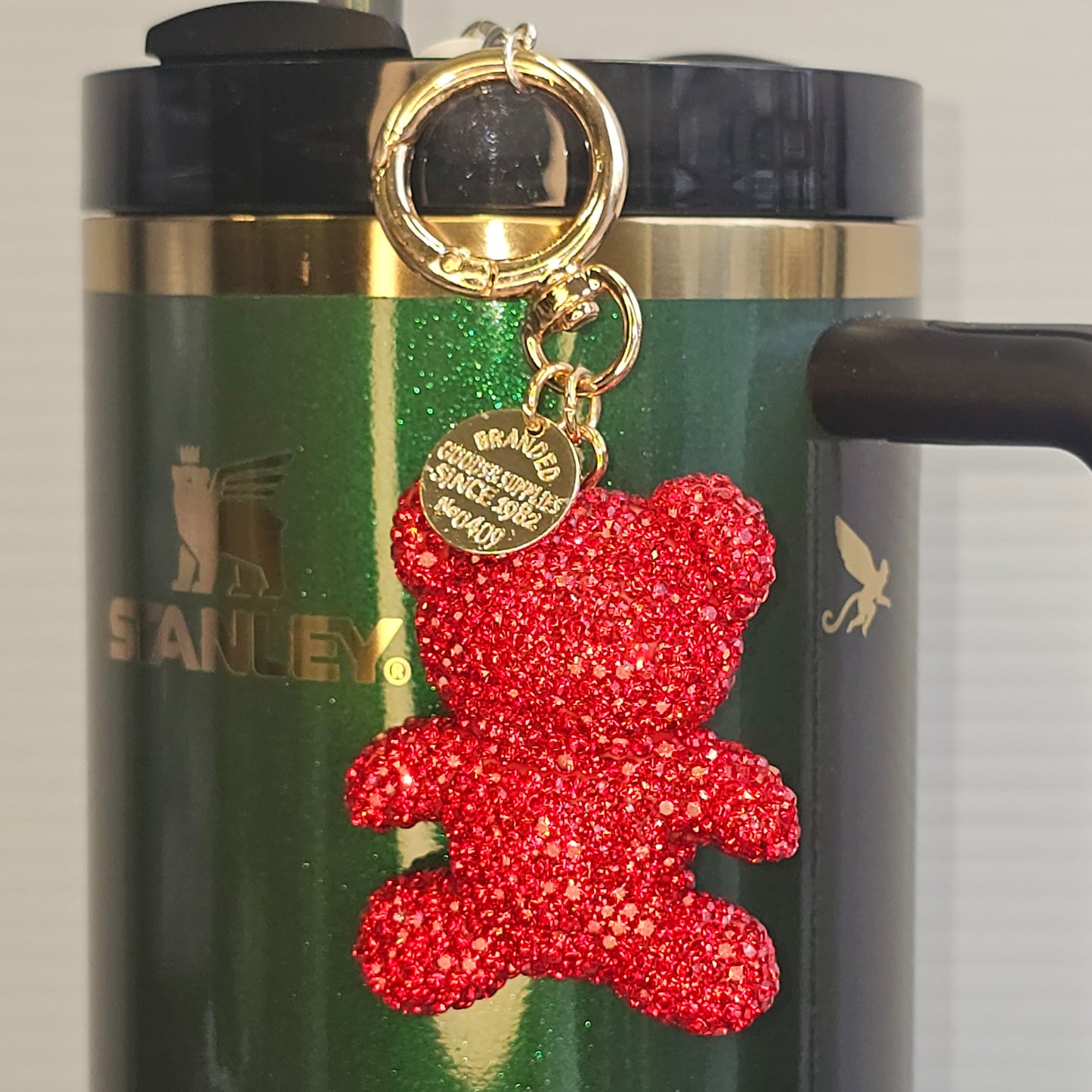 Red Glitter Teddy bear charm for tumbler straw, purse, bag, keychain, or backpack. Taken with camera flash.