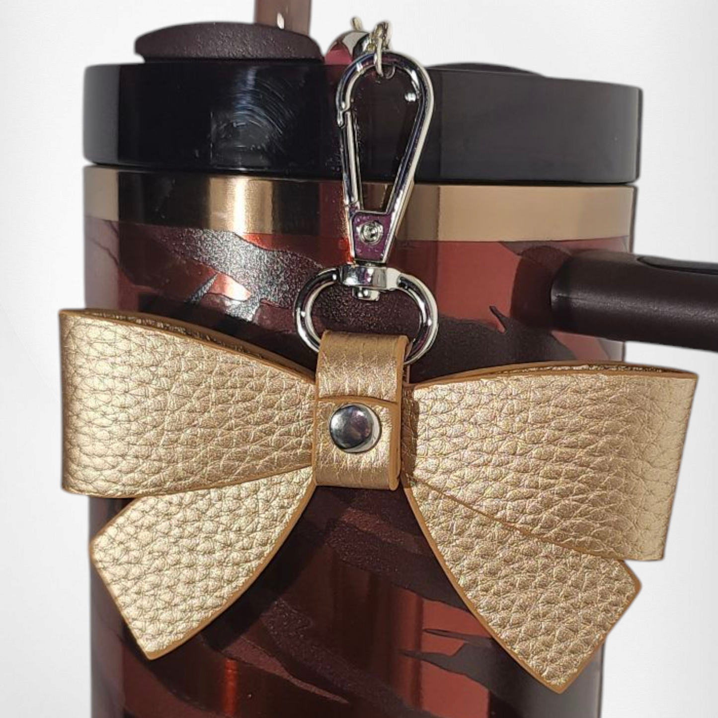 Gold faux leather ribbon bow charm pendant.