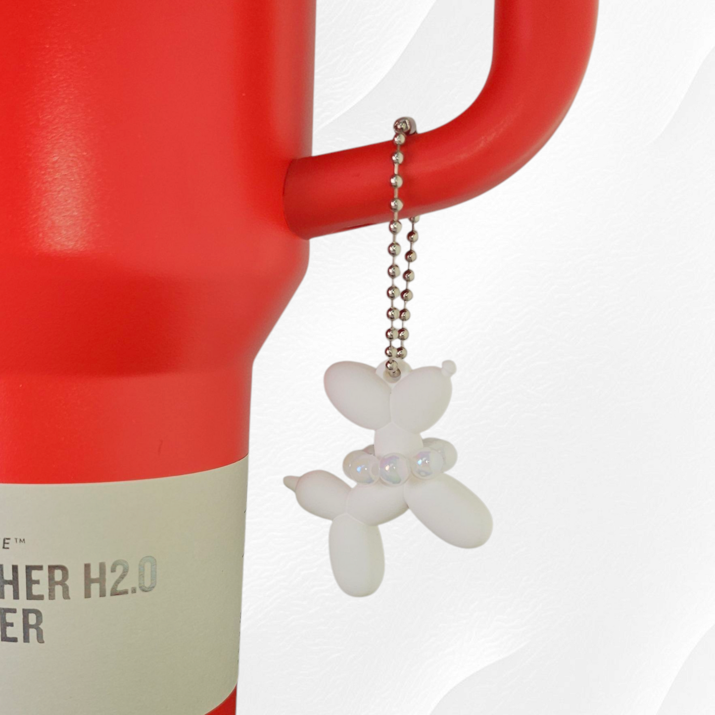 White Balloon Dog wearing white pearl necklace cup handle charm.