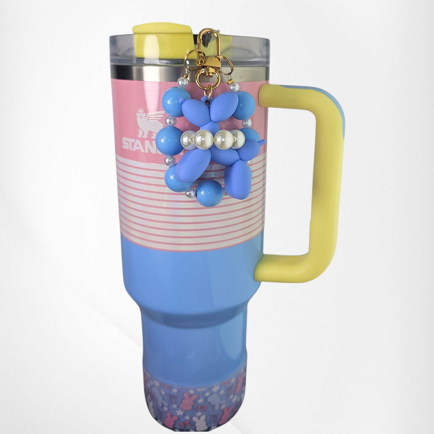 Blue Balloon Dog wearing a white pearl beaded necklace with a blue beaded charm bracelet. Use as a tumbler, purse, or keychain charm.