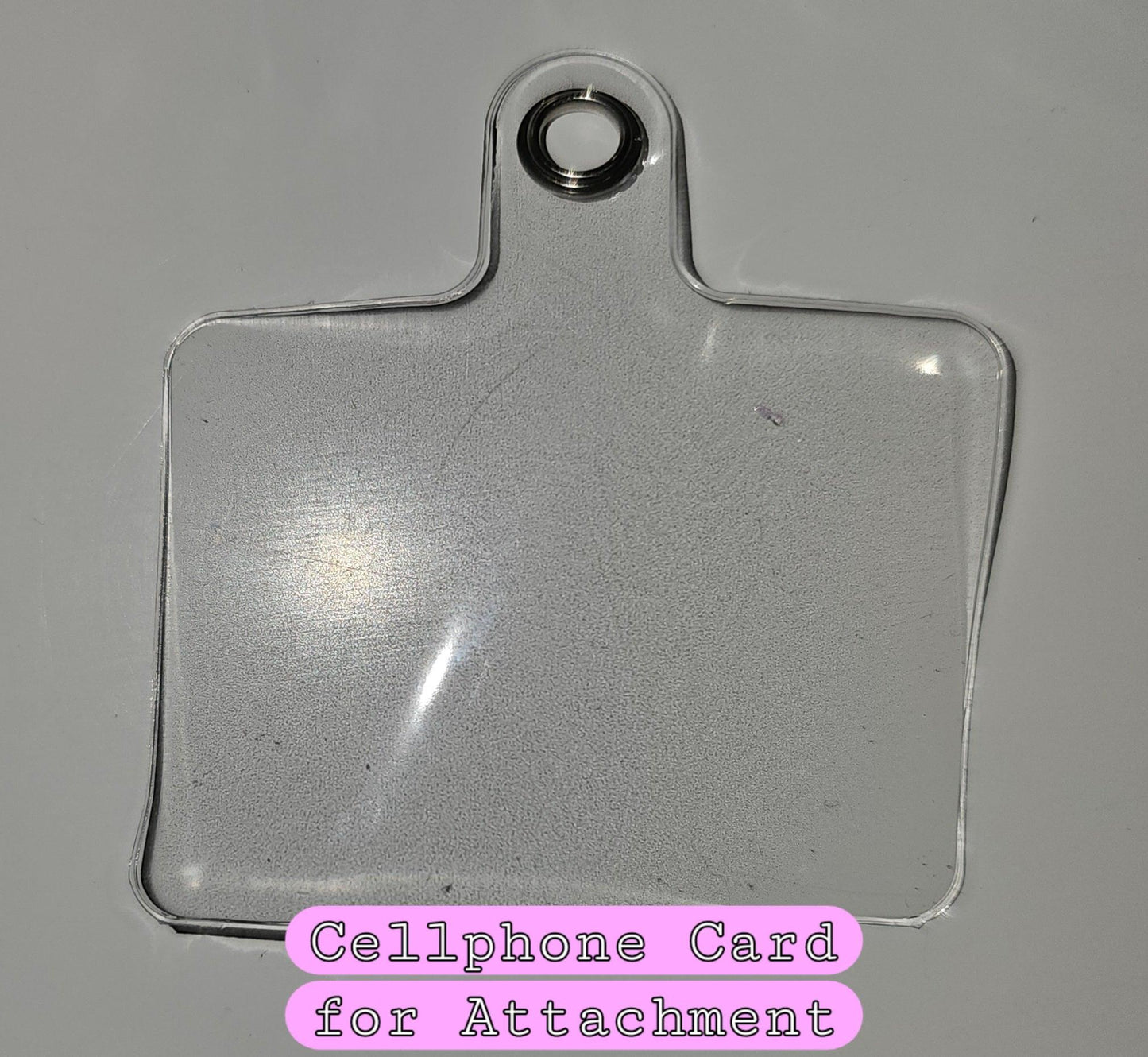 Clear cellphone charm adaptor.