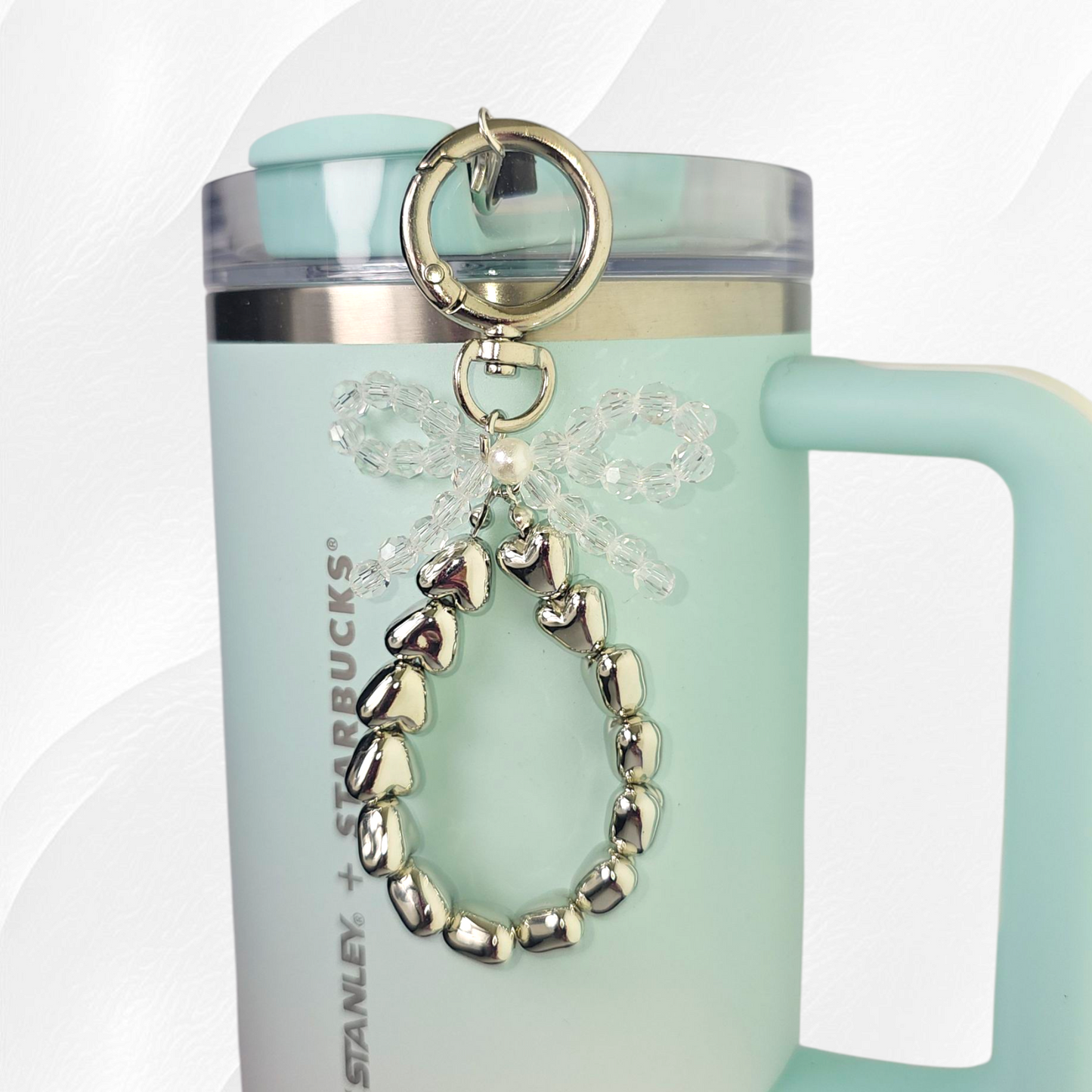 Clear Beaded Bow and silver hearts tumbler straw charm.