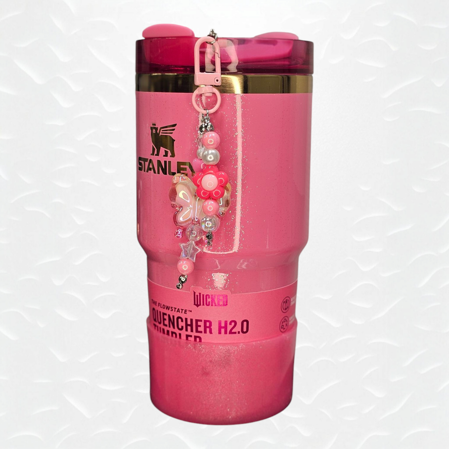 Irrelevant Pearlescent Pink Ombre Butterfly, Pink Daisy Flower, and Pink Beaded Charm Pendant.