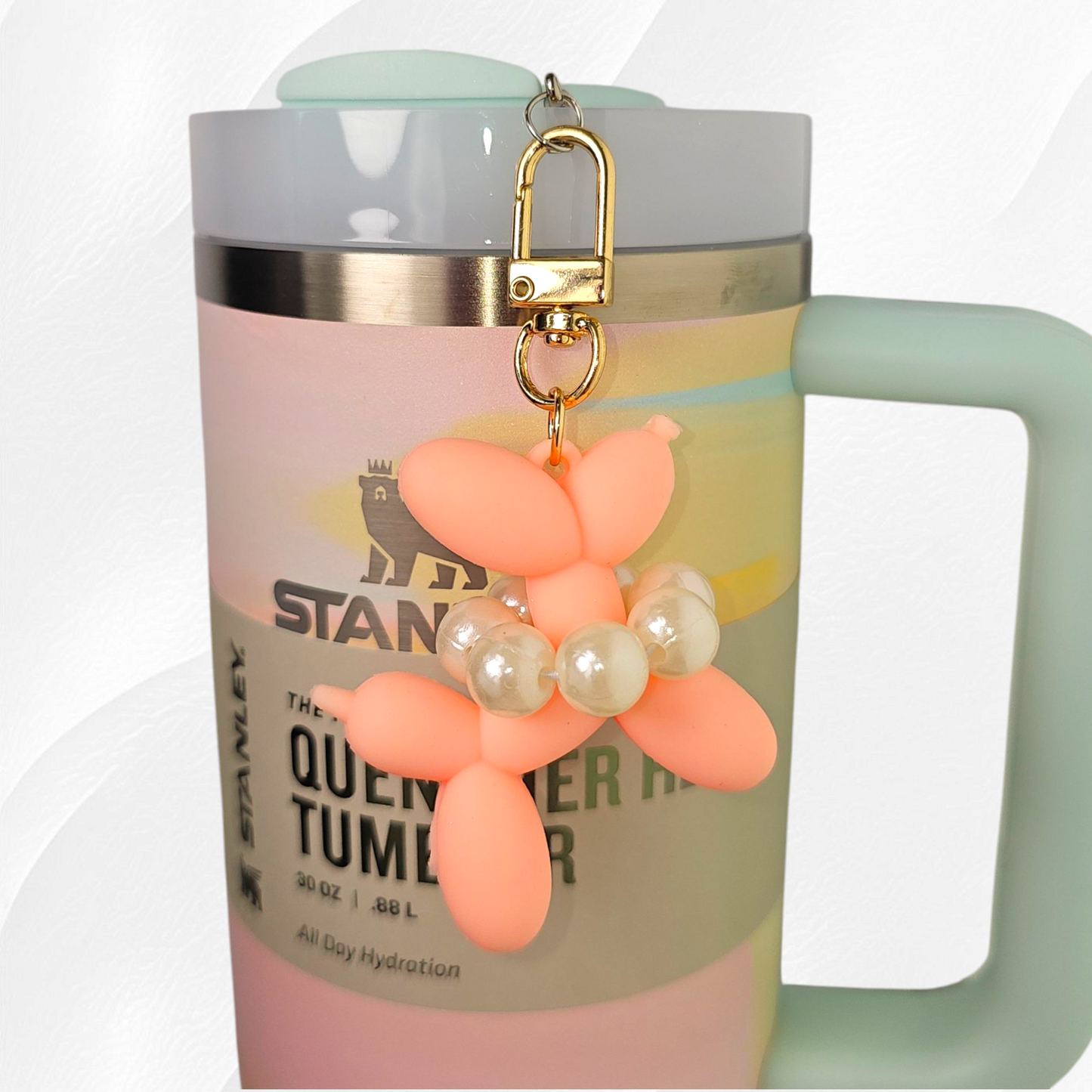 Peachy pink Silicone Balloon Dog and gold swivel lobster clasp tumbler charm.