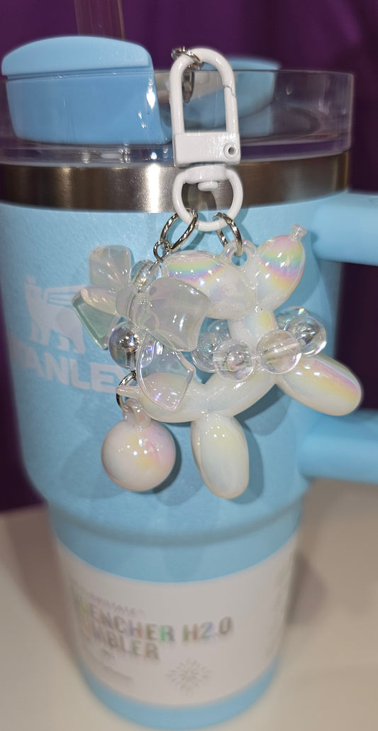 Iridescent Pearlescent White Balloon Dog with Ribbon Bow and bead charm pendant. Use to accessorize tumbler straw, tumbler handle, purse, backpack, keychain, or cellphone. 