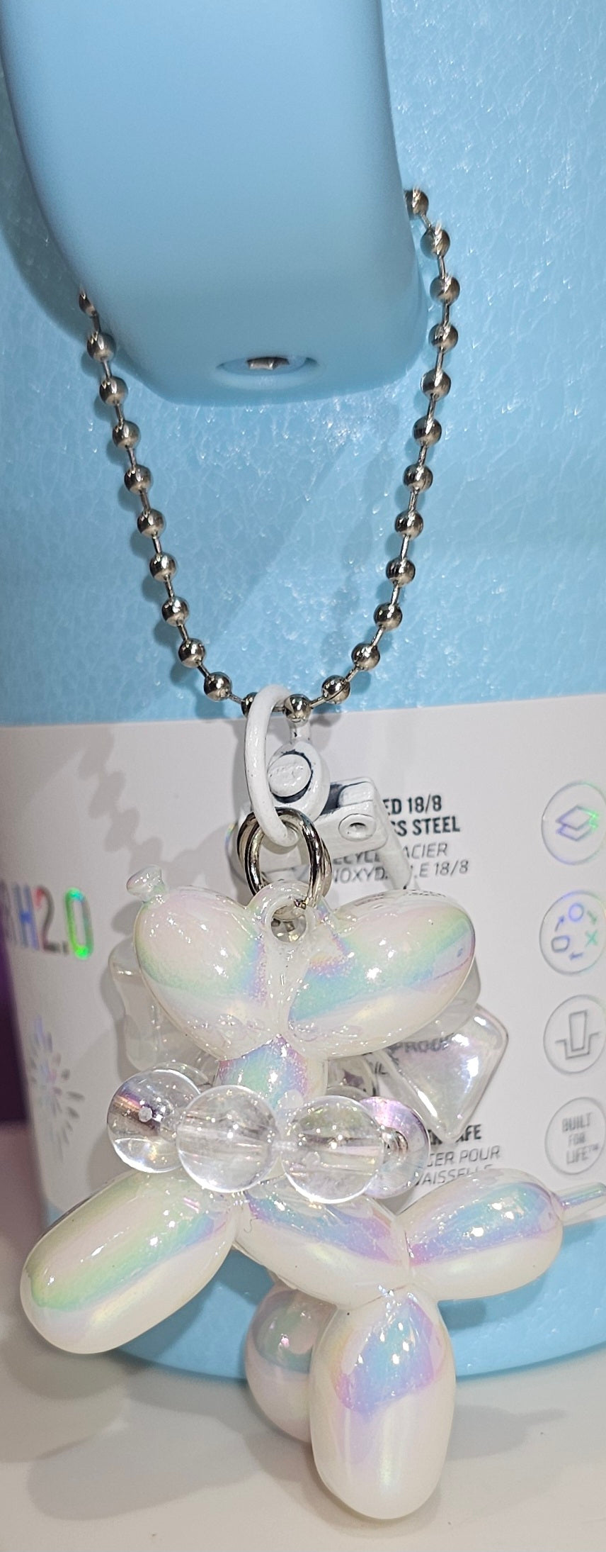 Iridescent Pearlescent White Balloon Dog with Ribbon Bow and bead charm pendant. Use to accessorize tumbler straw, tumbler handle, purse, backpack, keychain, or cellphone. 