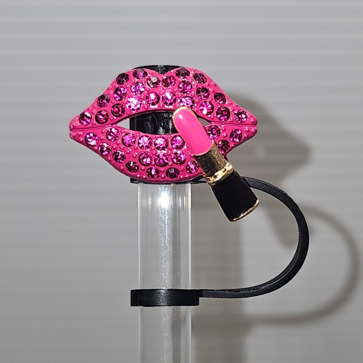 Blingy Pink Diamond Lips and Lipstick Charm with a silicon black straw topper base. With camera flash. 