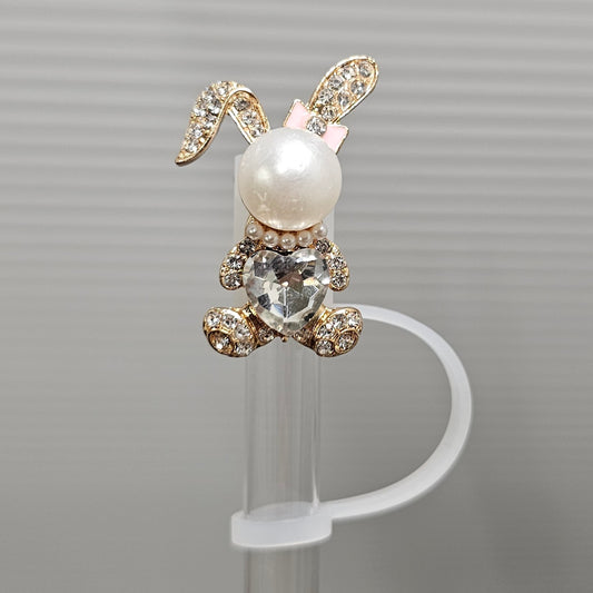 Gold, diamond, pearl Easter Bunny Silicone Straw Topper. Bunny is wearing a pink ribbon bow. 