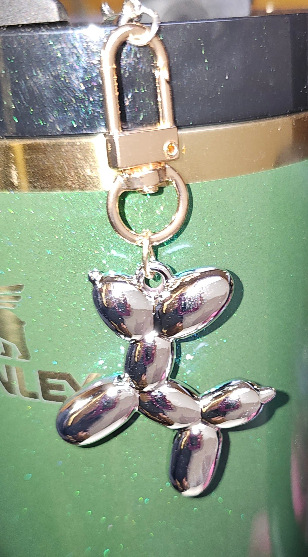 Chrome silver and gold balloon dog charm pendant. 