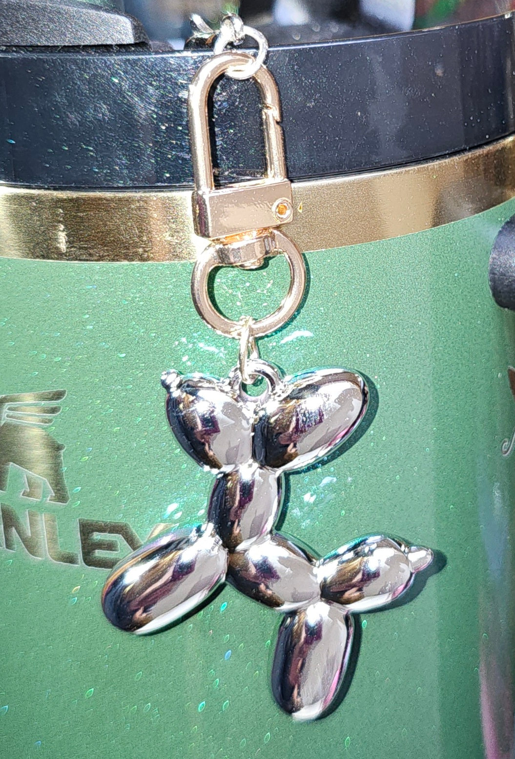 Chrome silver and gold balloon dog charm pendant. 