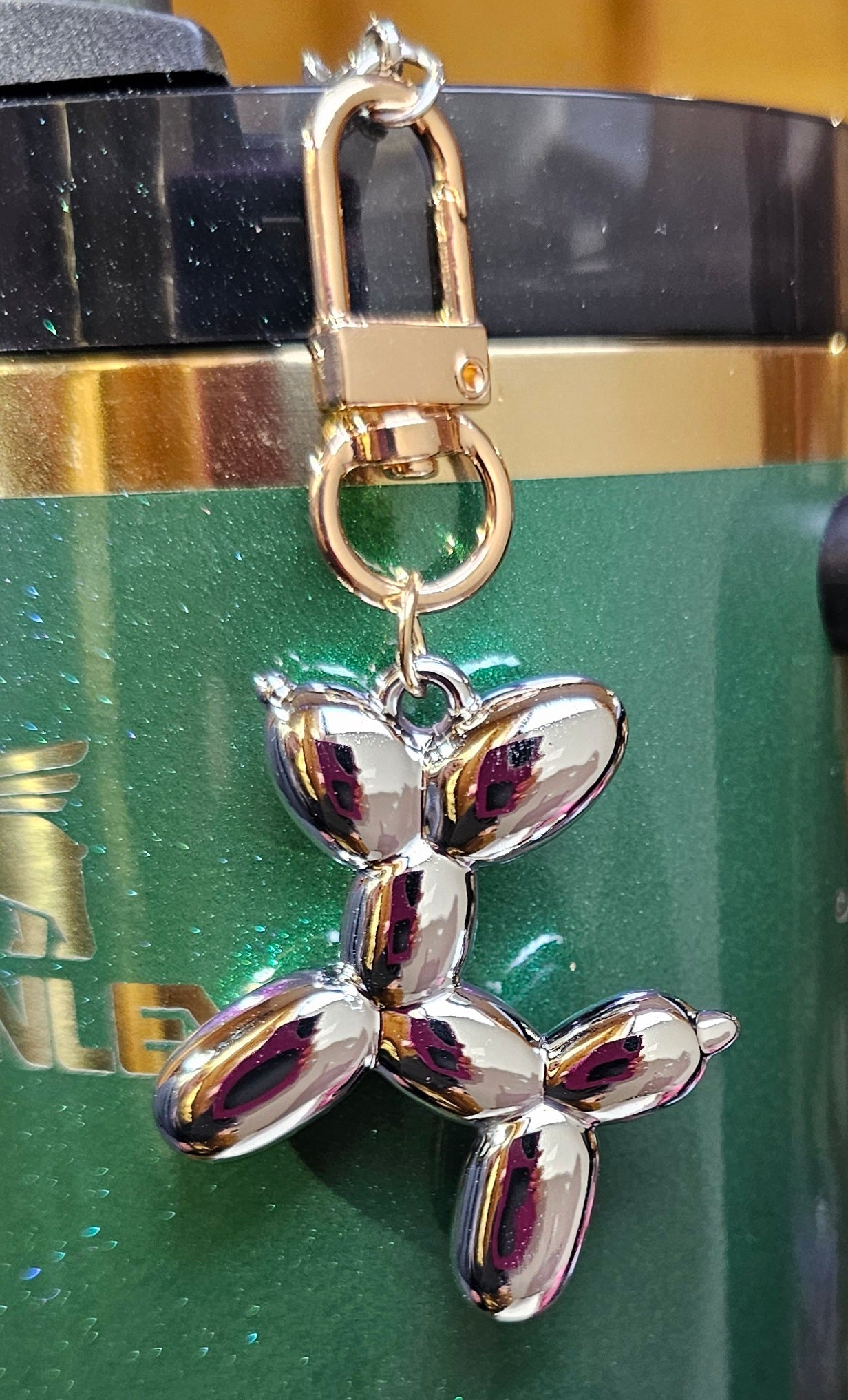 Chrome silver and gold balloon dog charm pendant. 