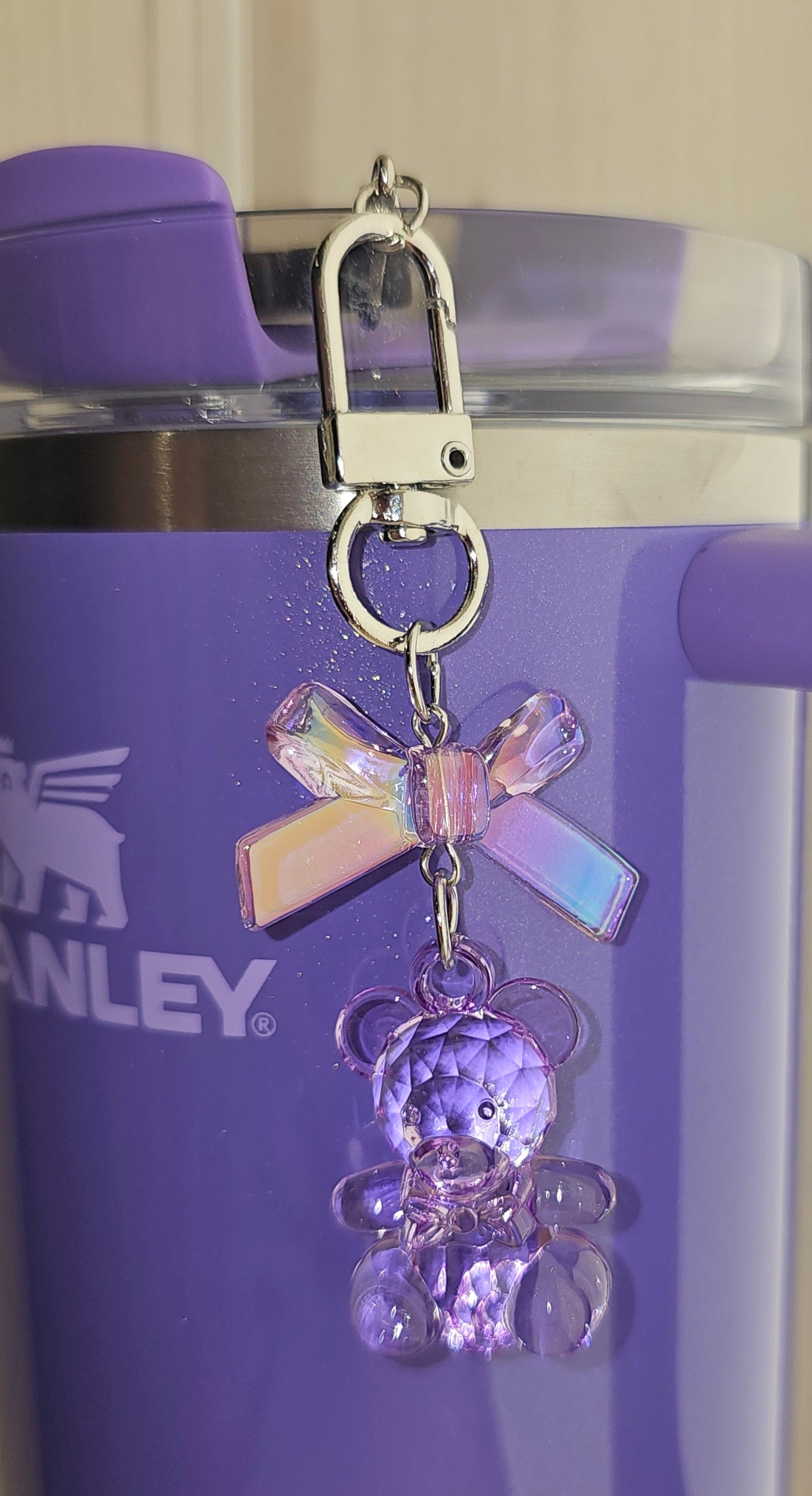 Crystal iridescent pearlescent Periwinkle Purple Coquette Ribbon Bow and Teddy Bear Charm Pendant. Use for straw charm, purse charm, bag charm, keychain charm, or cellphone charm. 