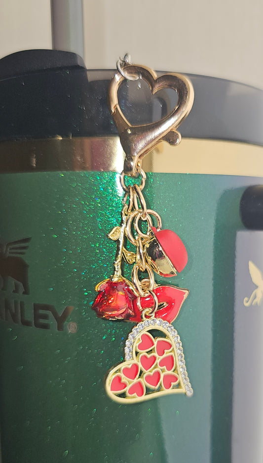 Valentine's Day Charm Pendant with Ruby Red Lips, Ruby Heart, Ruby Red Rose, and Ruby Red Glittery Hold Hearts Charms. Pictured on Wicked Elphaba Stanley as a straw charm. 