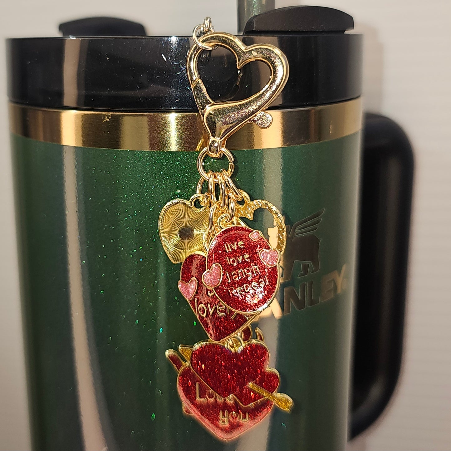 Valentine's Day Tumbler Straw Charm  - Love You. Red, Pink, and Gold Glitter Hearts Valentine's Day Straw Charm  - Straw Dangle. Imaged on Stanley's Wicked Elphaba tumbler. 