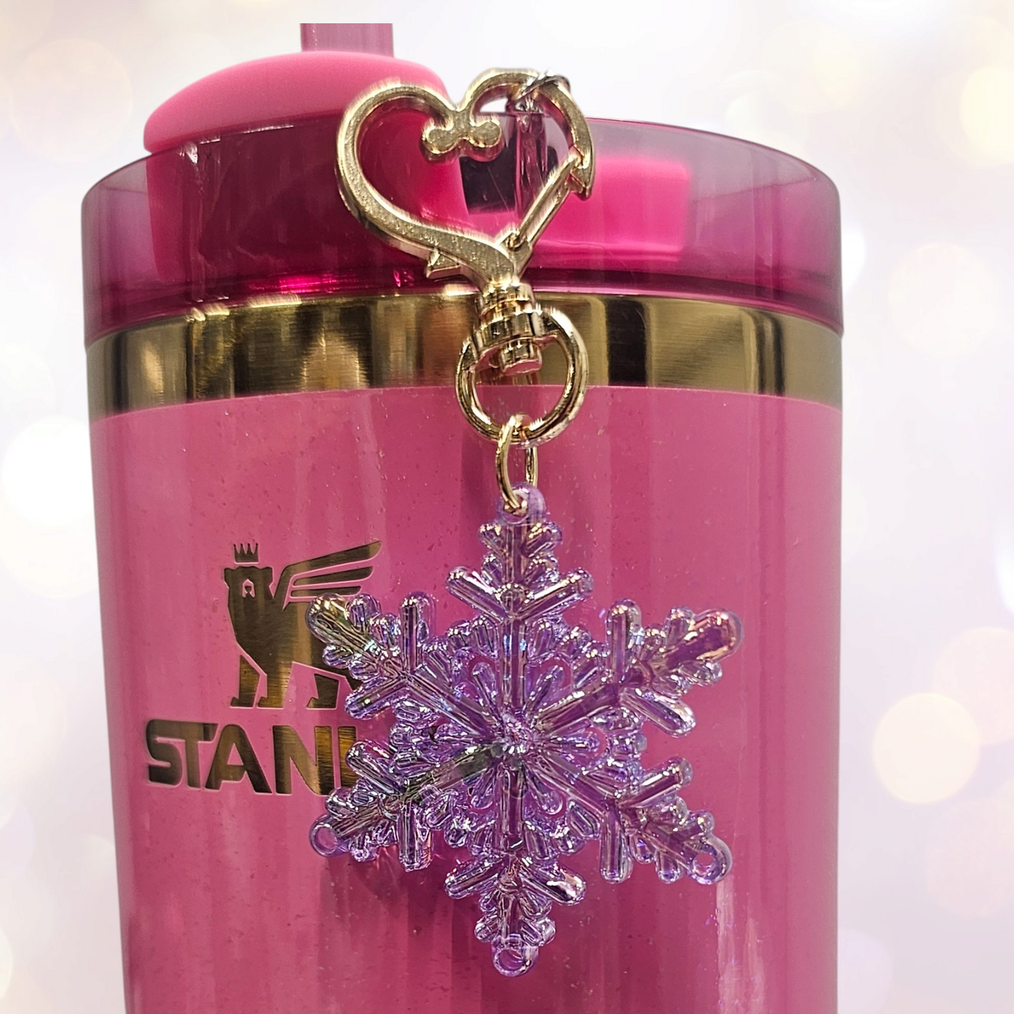 Pearlescent purple Snowflake tumbler straw charm with gold heart clasp. 