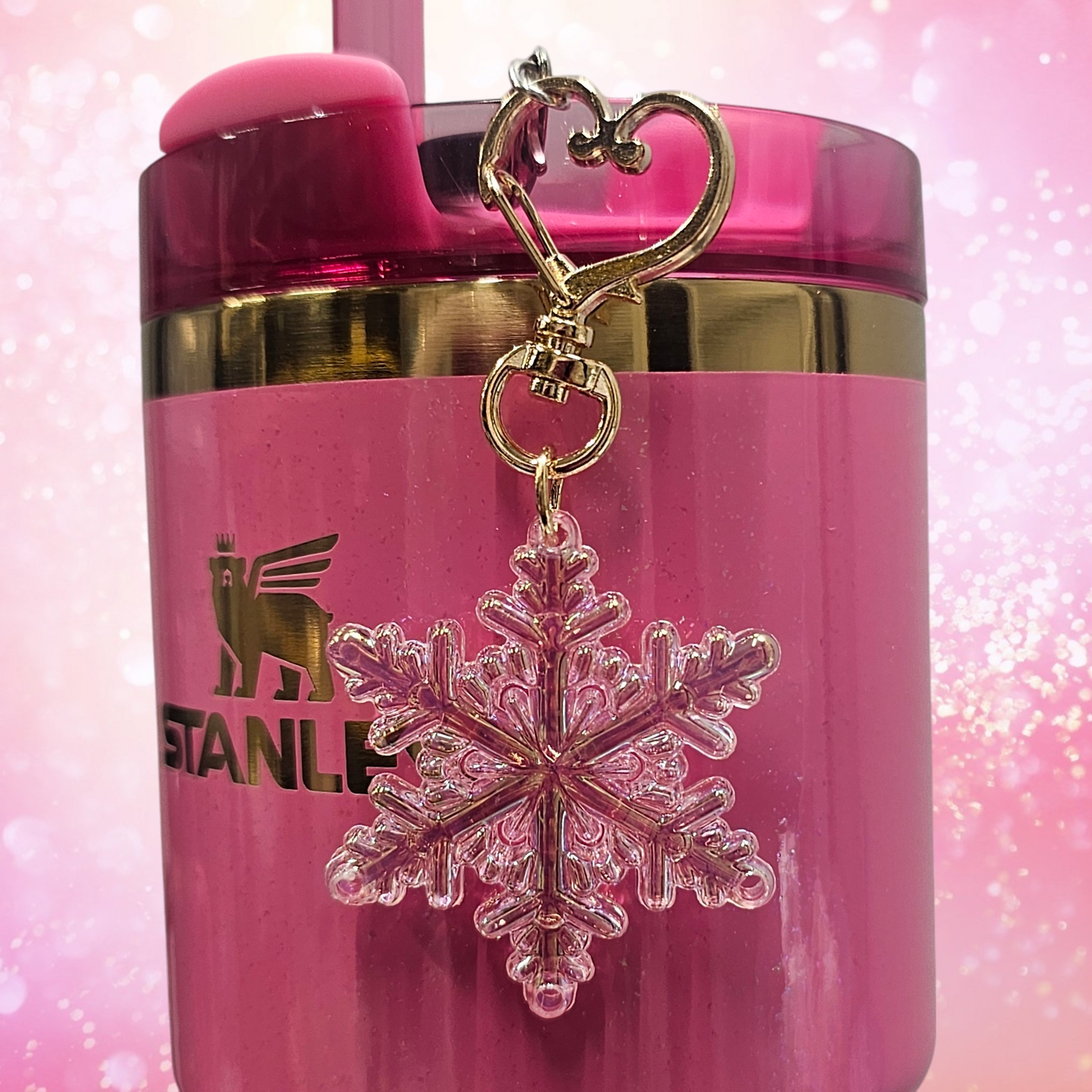 Pearlescent pink Snowflake tumbler straw charm with gold heart clasp. 