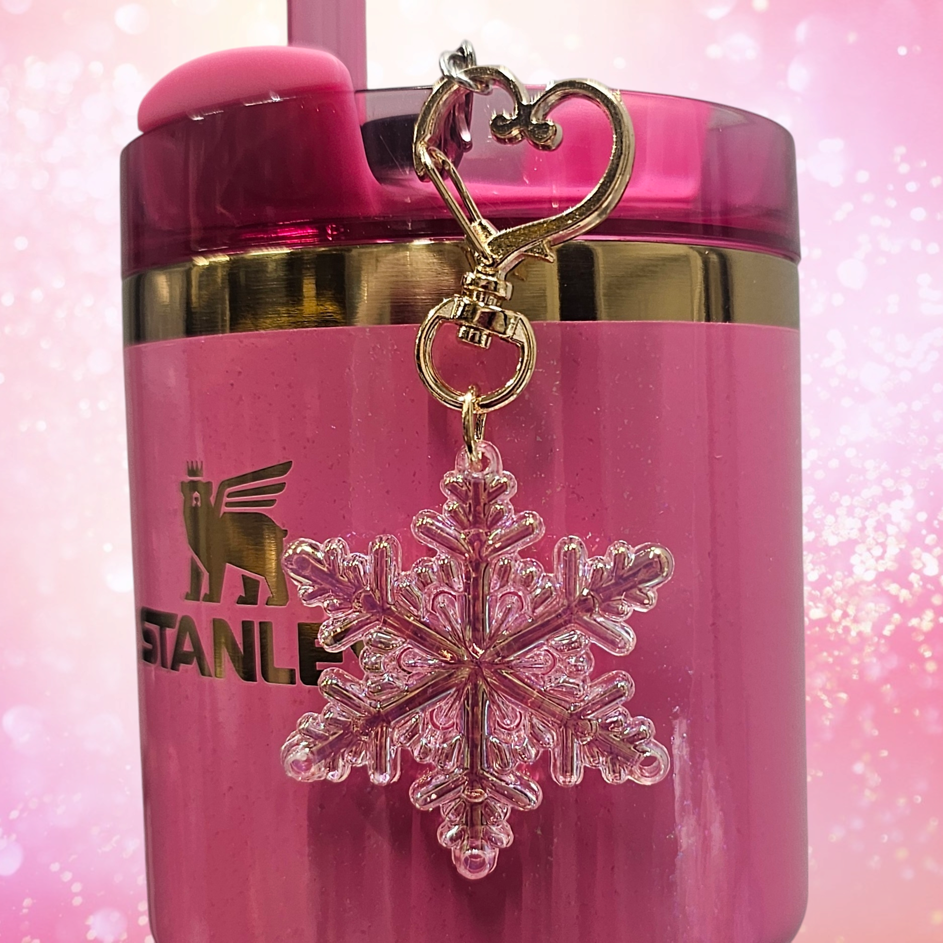 Pearlescent pink Snowflake tumbler straw charm with gold heart clasp. 