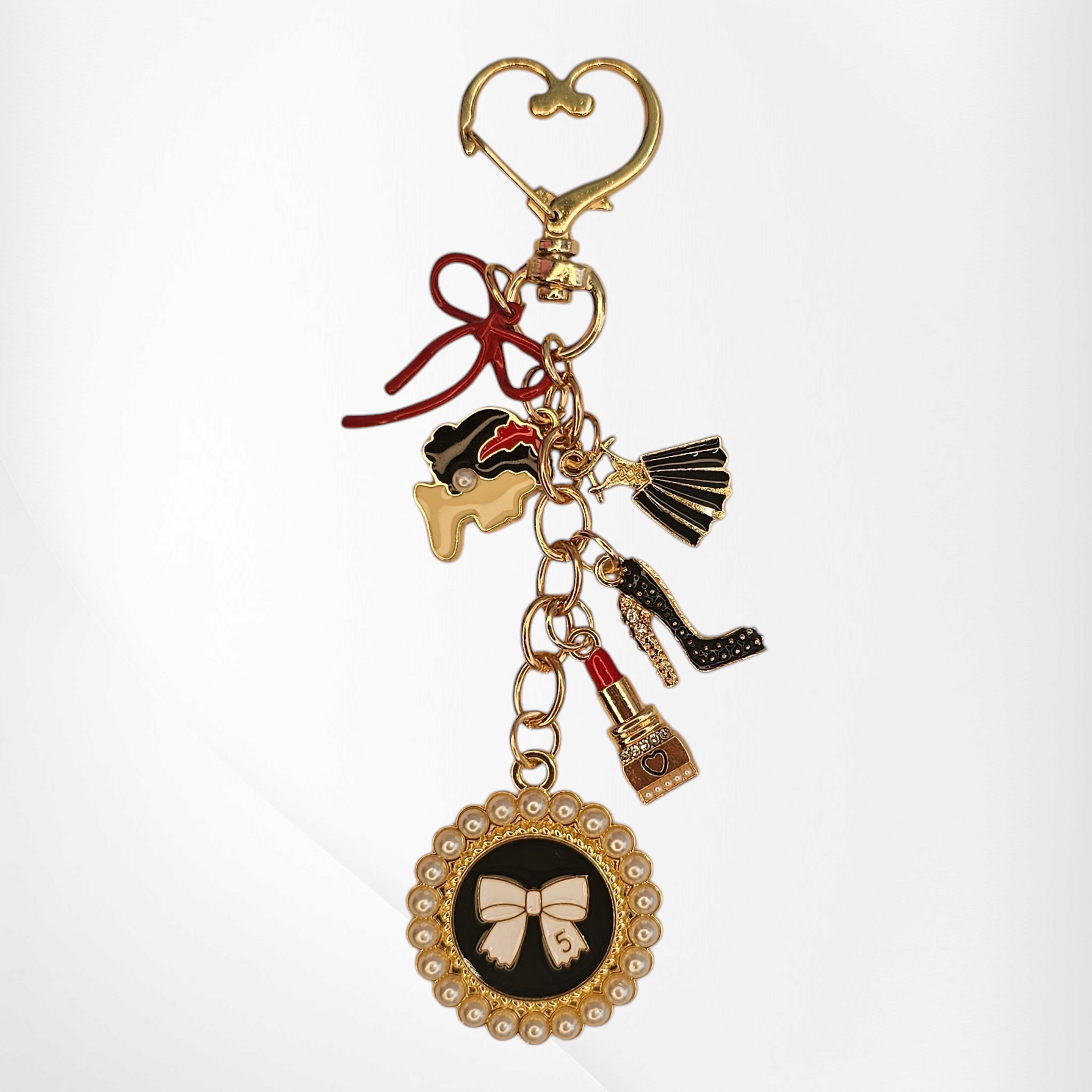 Luxury tumbler straw charm dangle for the classy Diva. 

Colors are gold, black, white, and red. 

Charms consist of glitter lipstick, glitter high heel, white pearl bow, red bow, and a cameo for the classy diva. 