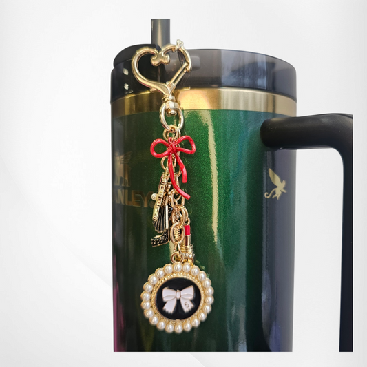 Luxury tumbler straw charm dangle for the classy Diva. 

Colors are gold, black, white, and red. 

Charms consist of glitter lipstick, glitter high heel, white pearl bow, red bow, and a cameo for the classy diva. 