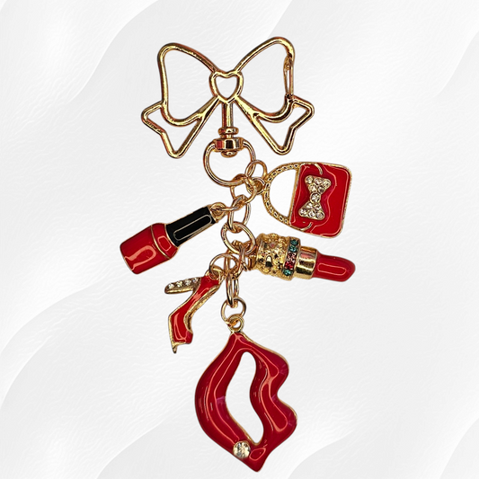 Red, Black, and Gold Classy Diva Charm Pendant with Ruby Red Lips, Ruby Red Lipstick, Ruby Red Fingernail Polish, and Ruby Red Purse Charms adorned with diamond jewels. 