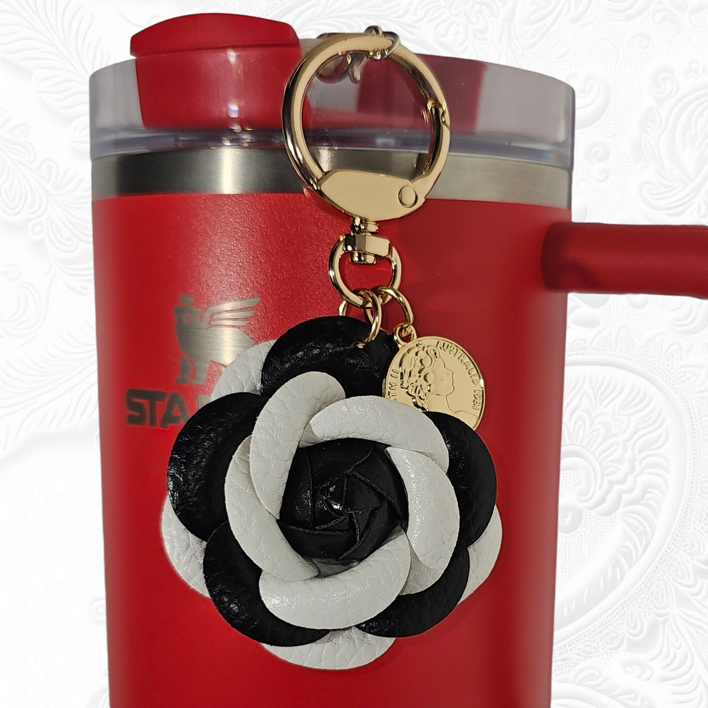 Black and White Camelia Flower with gold keyring and swivel tumbler straw charm. 