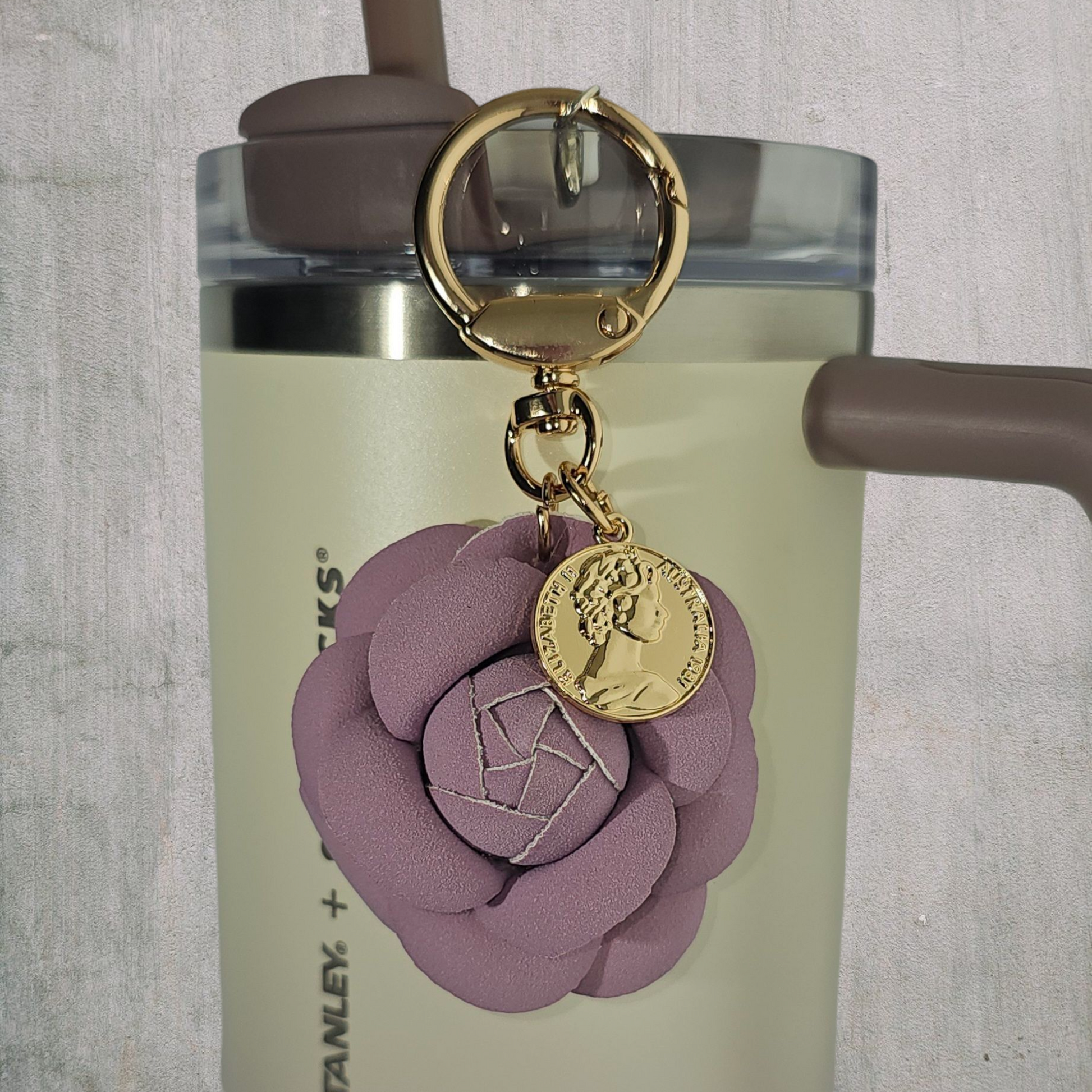 Lavender Purple Camelia flower with gold swivel keyring tumbler straw charm. 