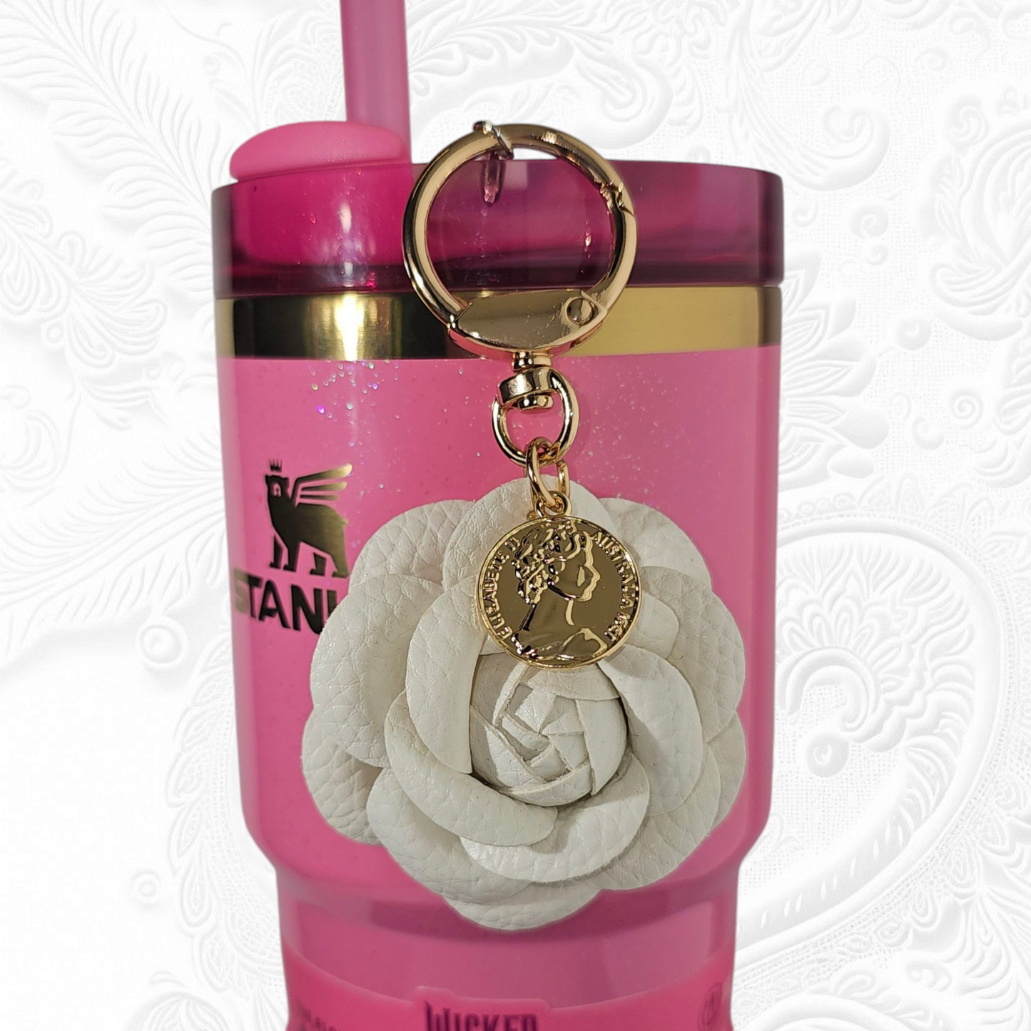 Luxury white camelia flower with a gold swivel keyring tumbler straw charm. 