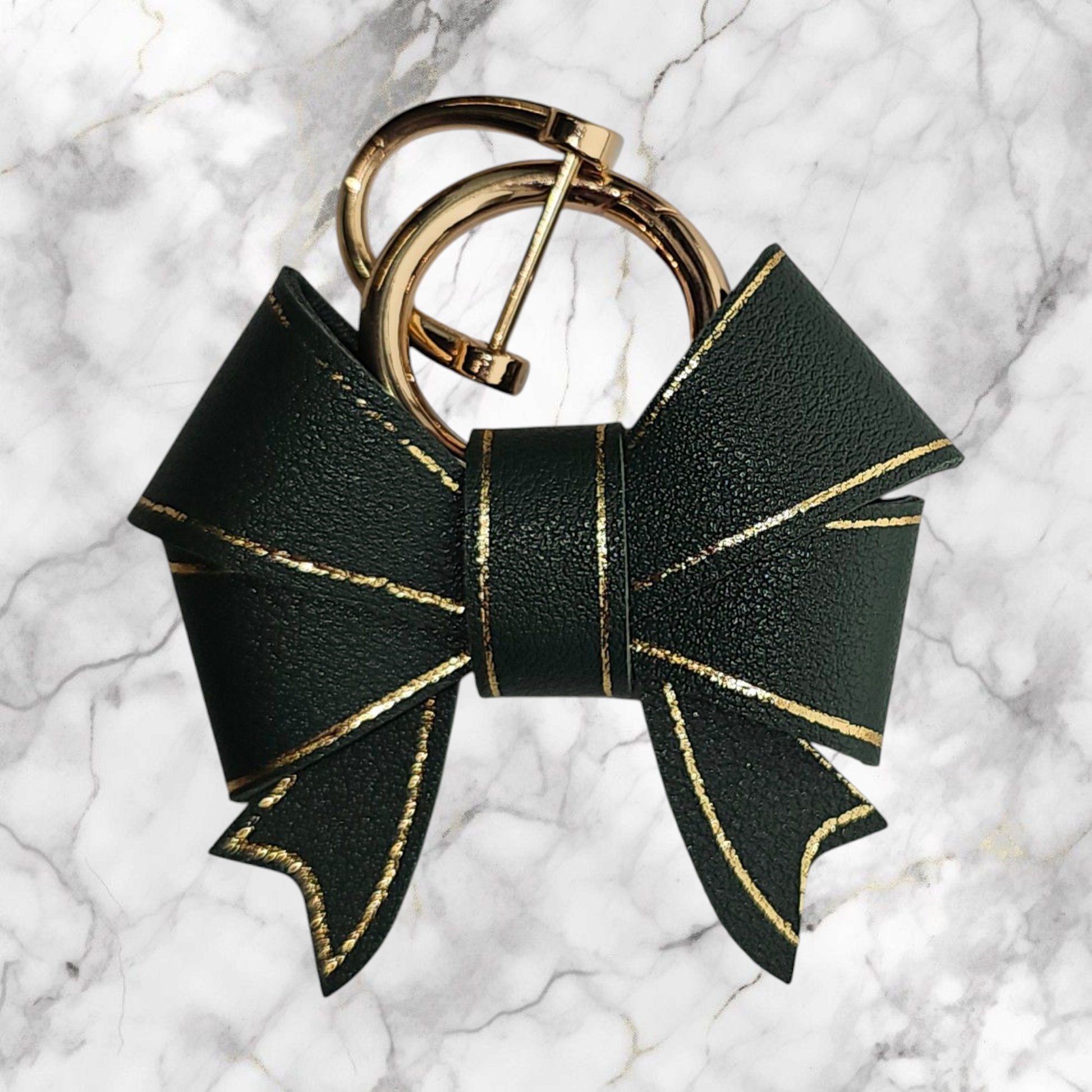 A luxury hunter green faux leather bow trimmed in gold charm pendant that can be used as a charm for your tumbler, tumbler straw, purse, bag, keychain, backpack, or cellphone. Pictured with extra gold keyring. 