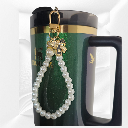 Gold and black Ribbon Bow and Faux Pearl Beaded Tumbler Charm Bracelet. Can be used as cellphone charm Bracelet. Comes with cellphone card adaptor. 