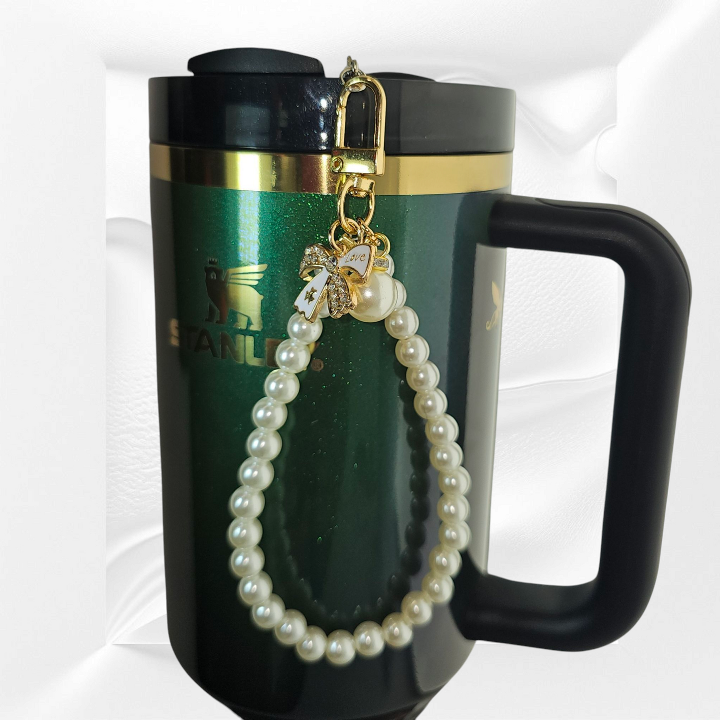 Gold and white Ribbon Bow and Faux Pearl Beaded Tumbler Charm Bracelet. Can be used as cellphone charm Bracelet. Comes with cellphone card adaptor. 