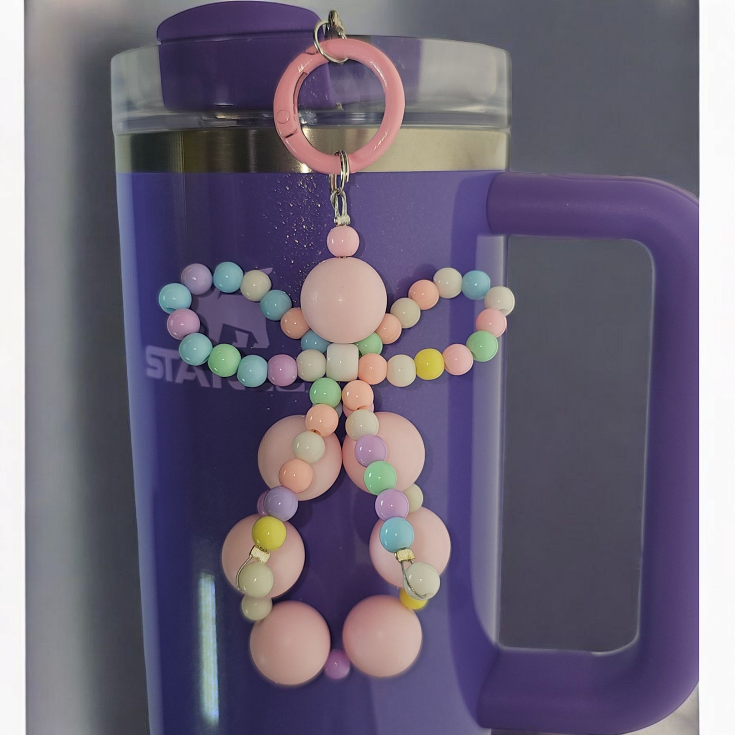 Jump pink beaded charm pendant with multicolor pastel beaded ribbon bow tumbler charm. 
